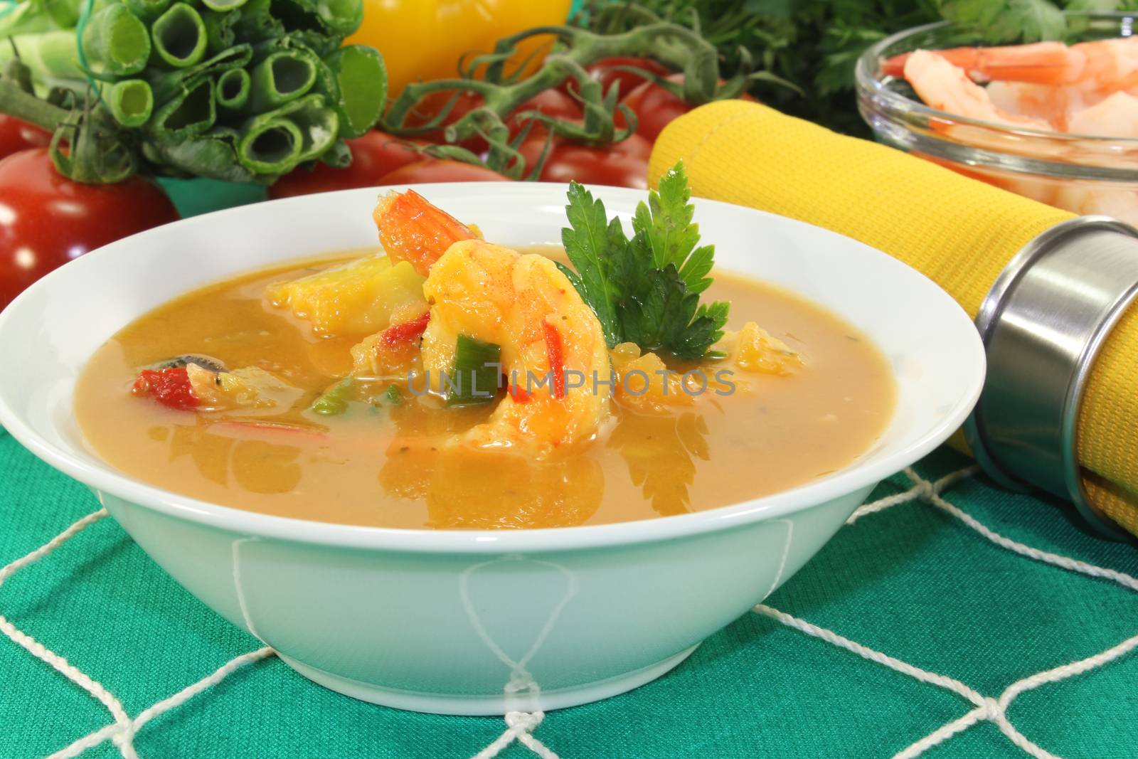 Curry soup with shrimp on a fishing net