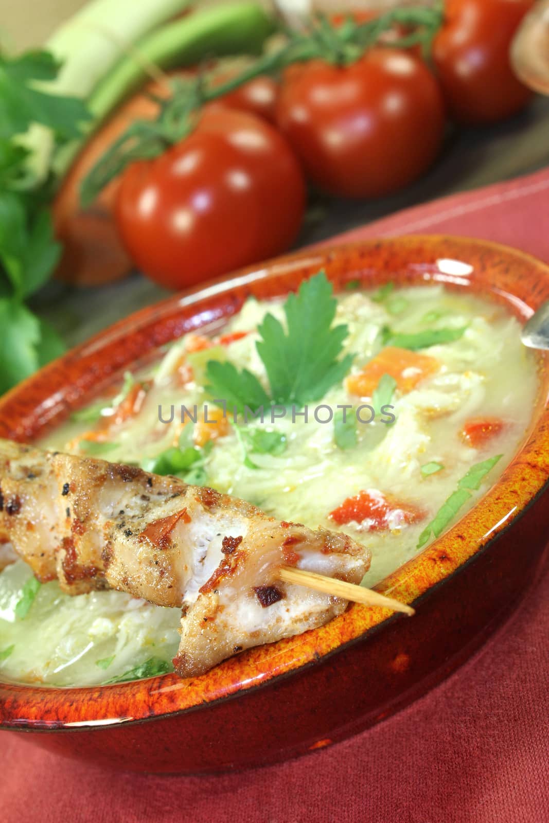 Chicken soup with chicken skewers and cooked pasta by discovery