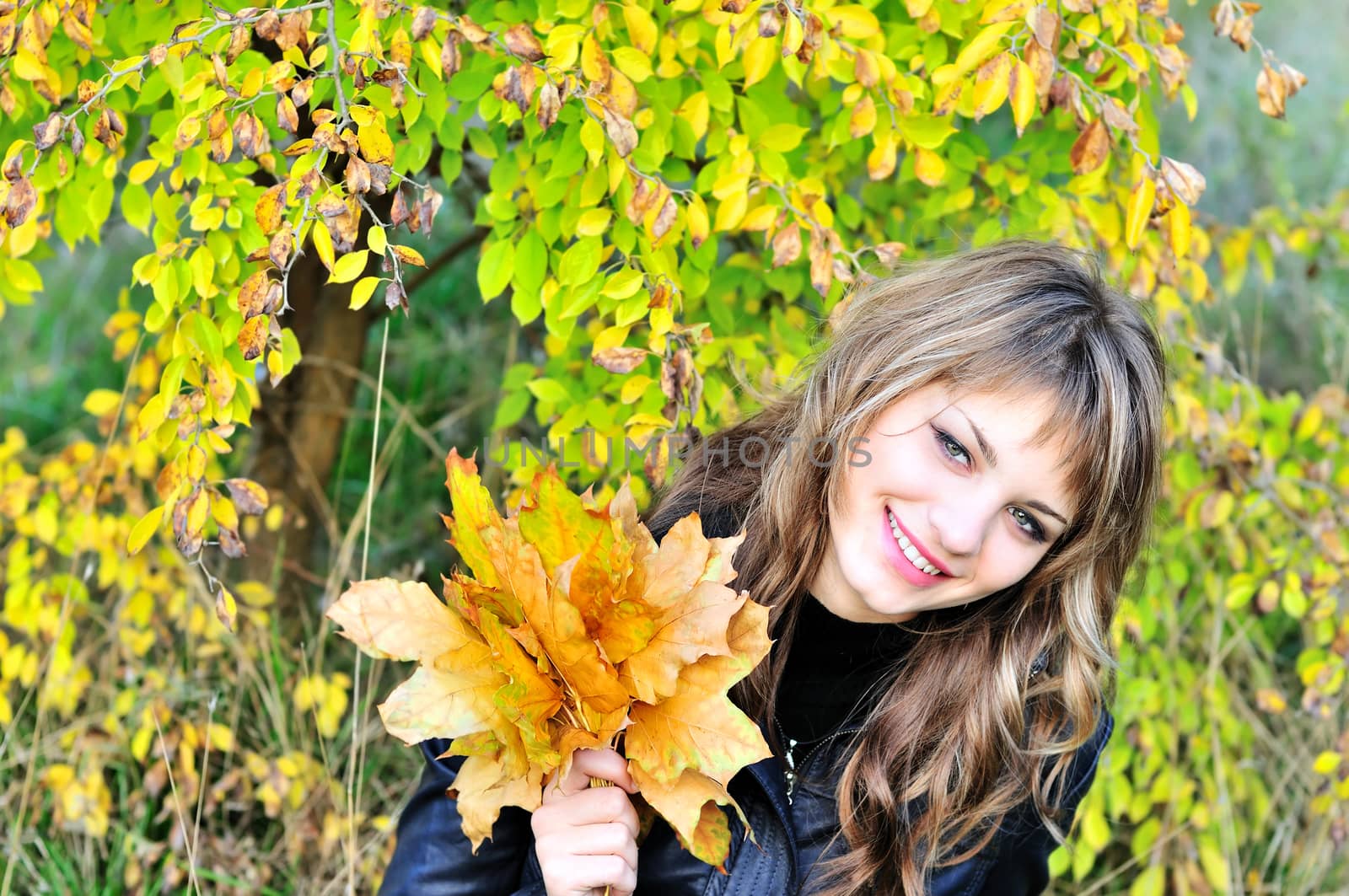 happy autumn girl in the fall forest