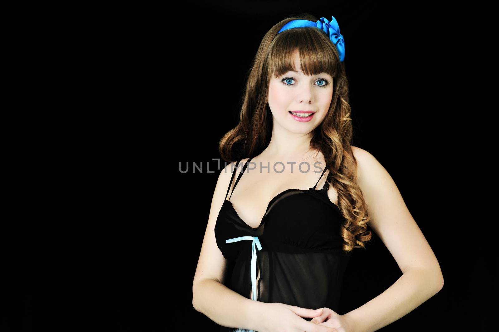 Blue-eyed pin-up sexy girl over black background 