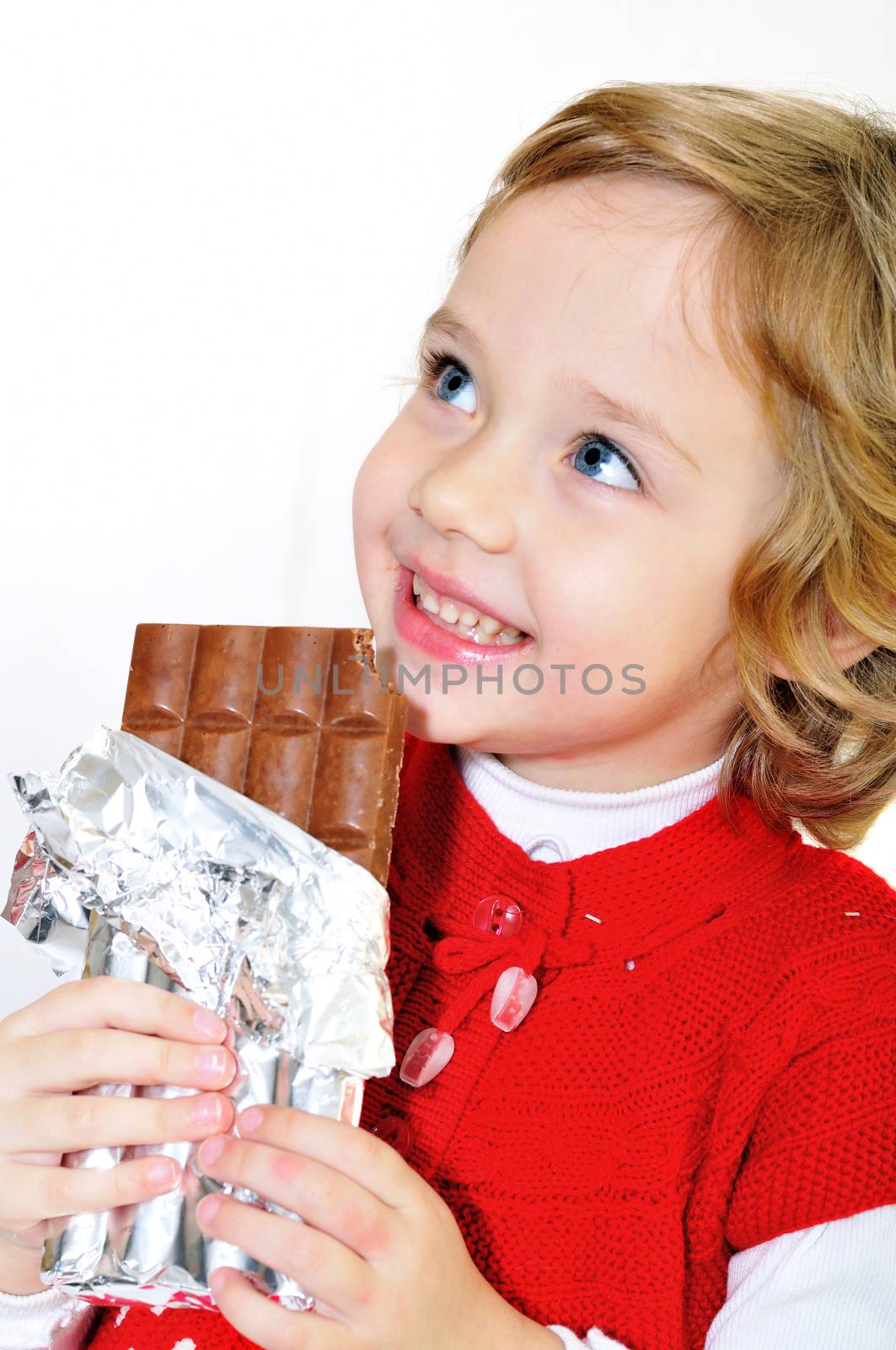 little pretty girl eating big chocolate bar