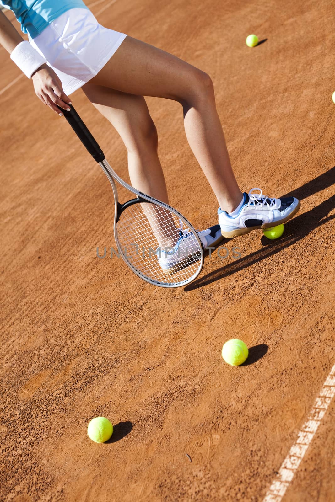 Playing tennis, summertime saturated theme