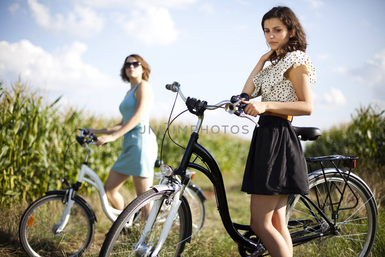 Woman riding bicycle, summer free time spending