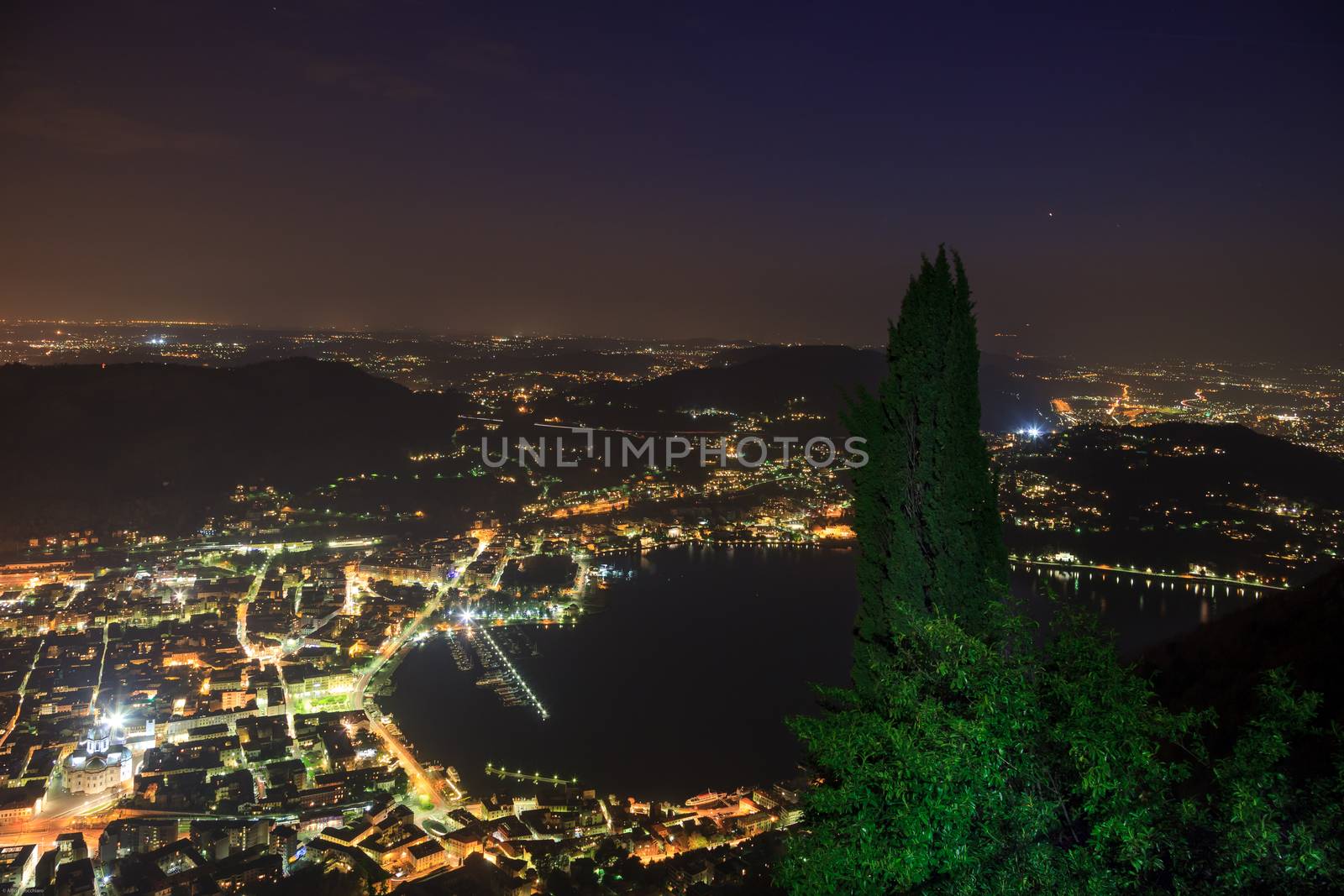 A nocturnal aerial view of Como and its lake from Brunate, Italy