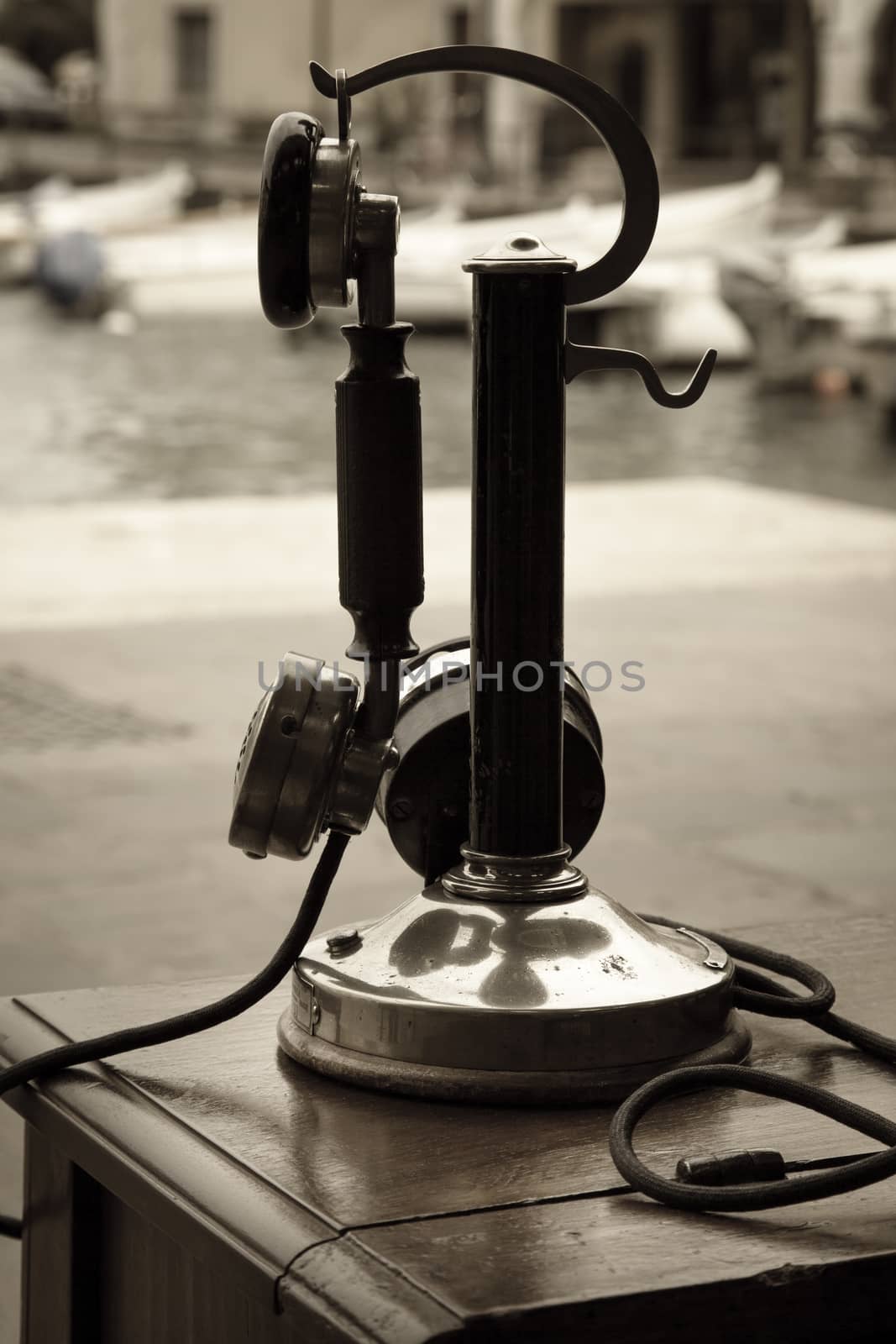An old telephone of the first years of the XX century exposed outside the bay of Lake of Garda, Italy