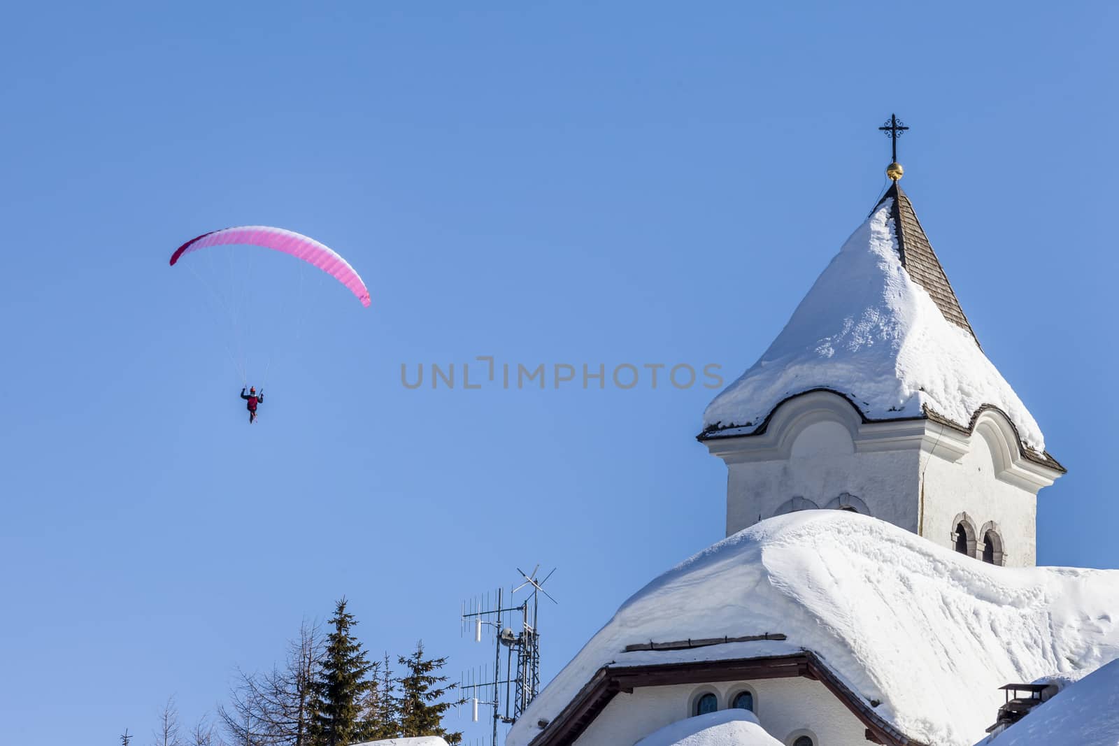 A man having fun with a paraglider. Italy