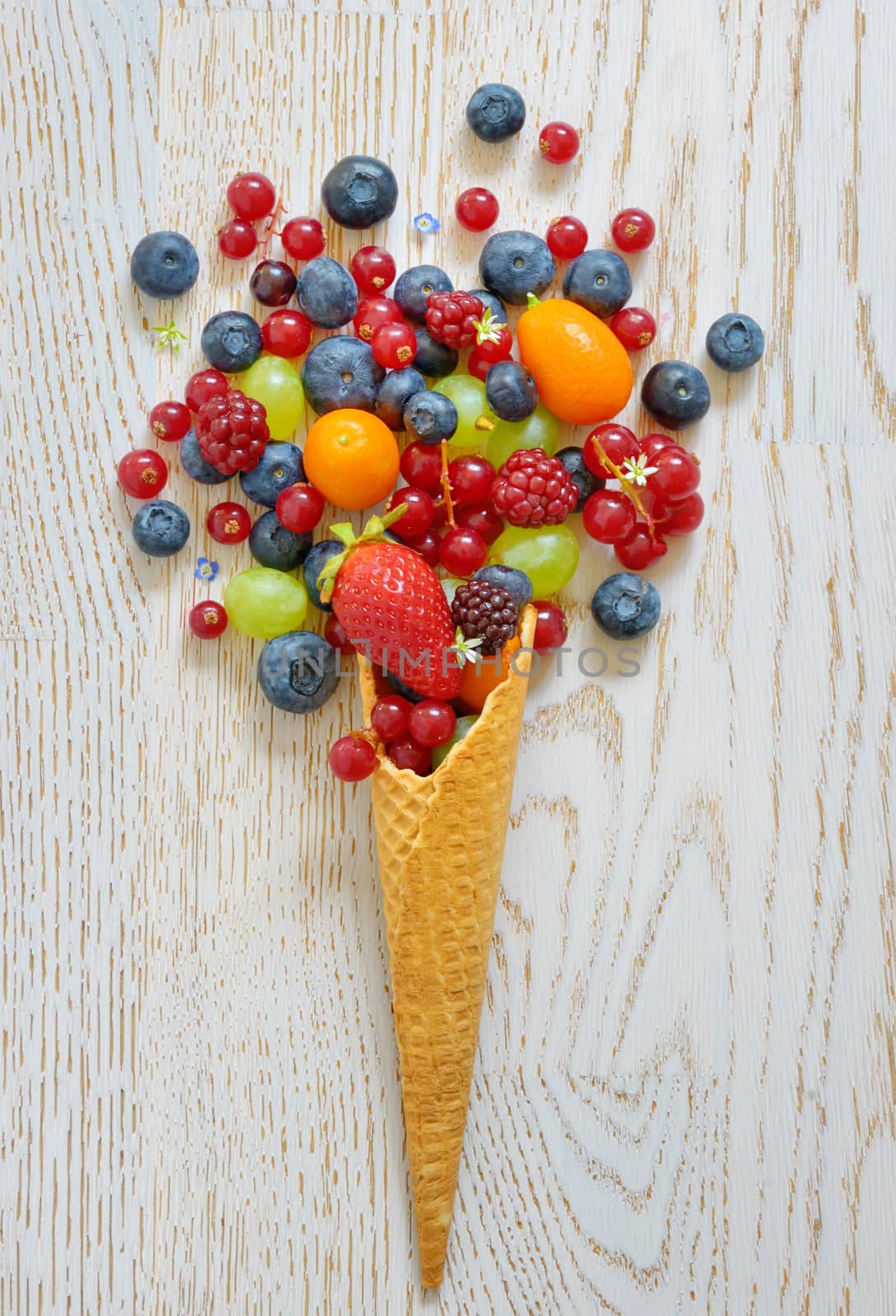 variety of fruits and  waffles cone