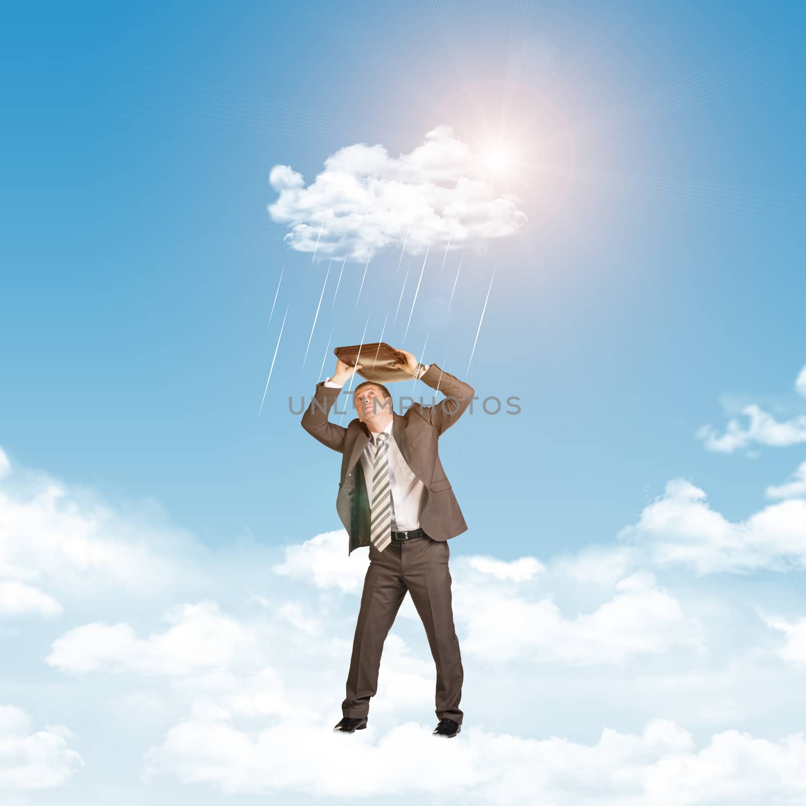 Businessman in suit standing on cloud and covered using briefcase from rain by cherezoff