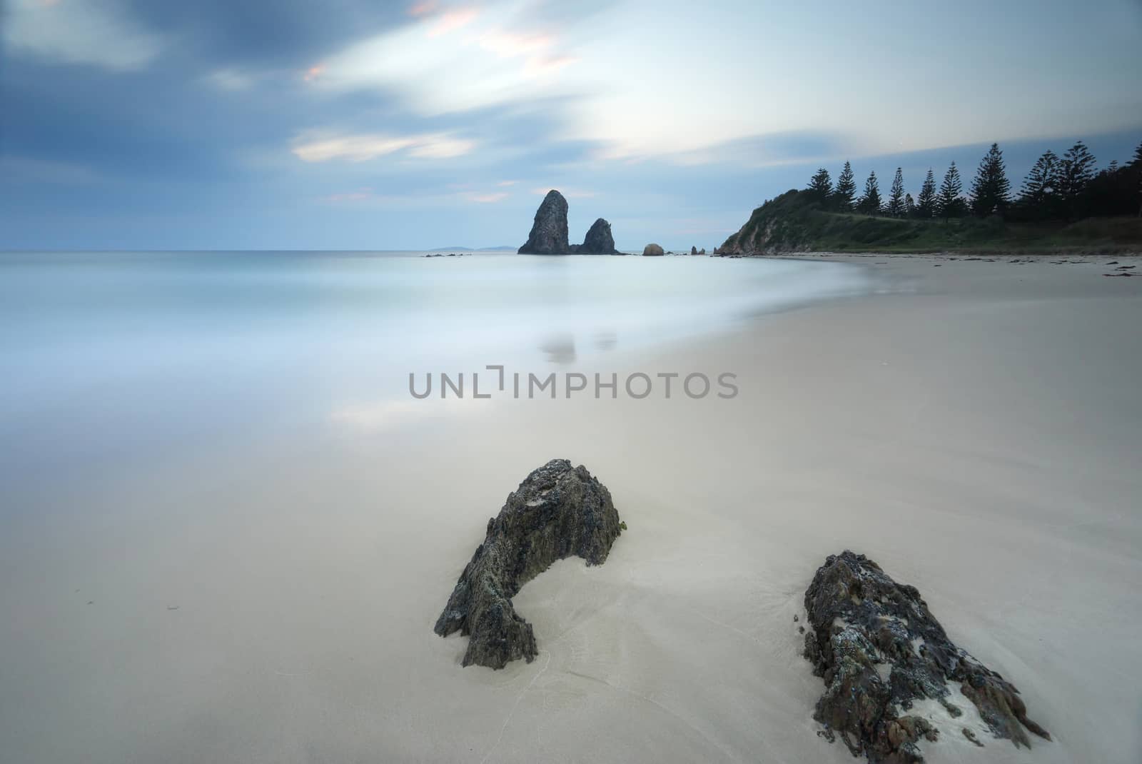 Long exposure taken at Glasshouse Rocks, the smooth surreal ocean and wispy clouds contrast to the sharp details of the foreground rocks.  The filter adding a vignette to the scene