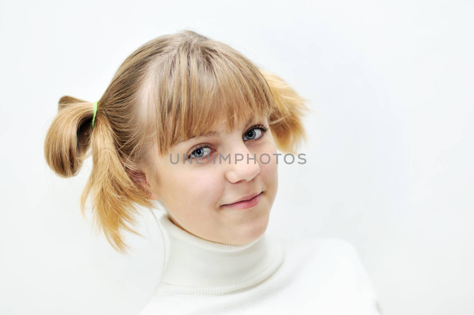 portrait of teen blonde girl with funny hairstyle