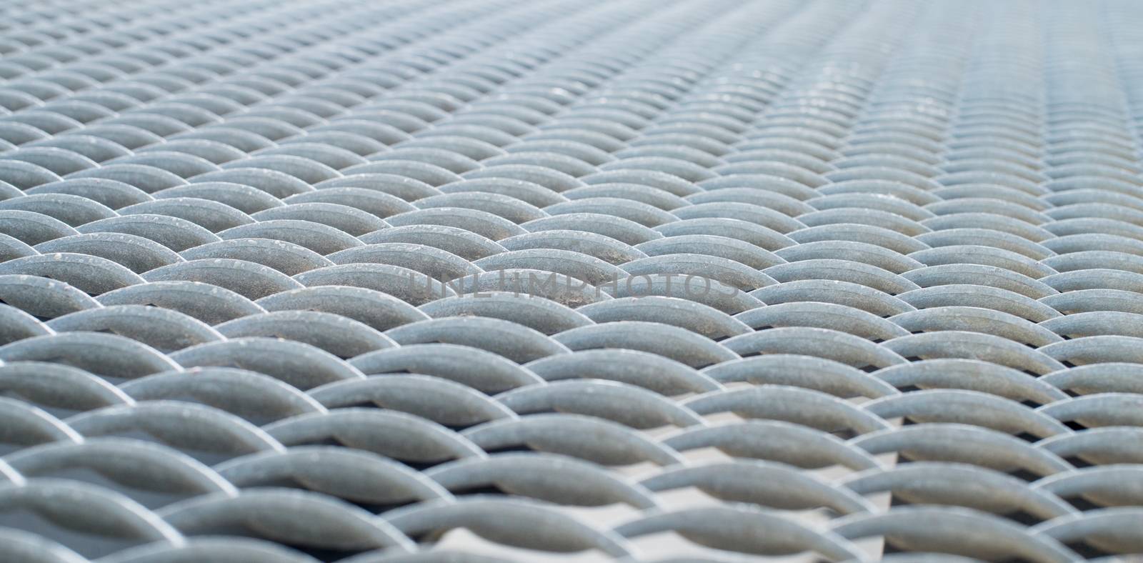 Gray metal mesh surface by rootstocks