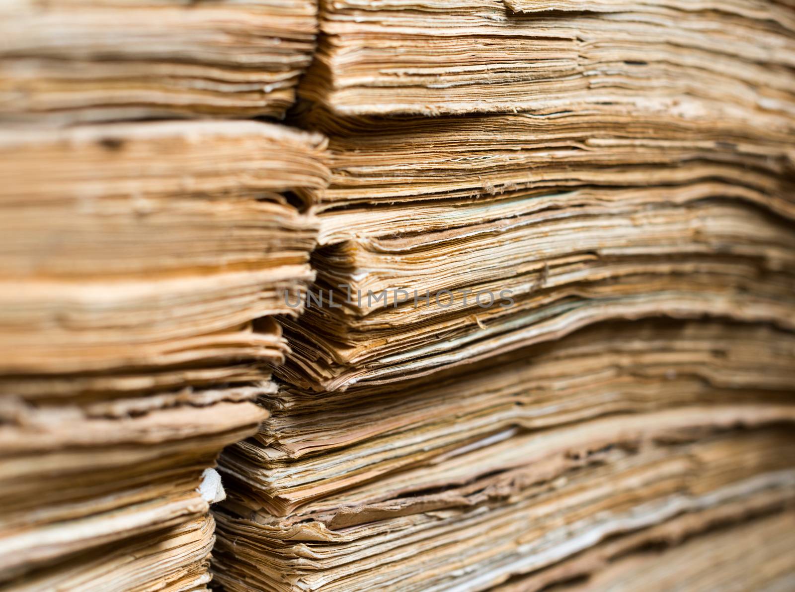 Stack of the old paper documents in the archive.