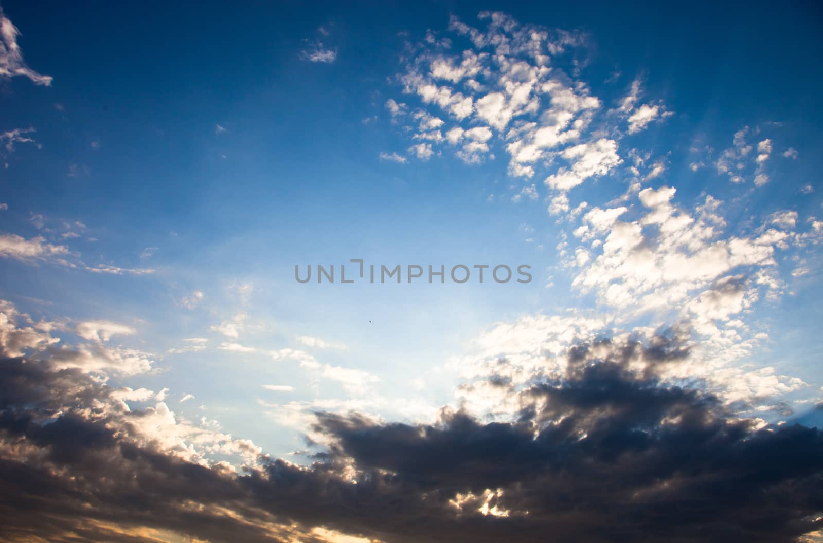 Cloudscape with the sun rays radiating from behind the cloud by rootstocks