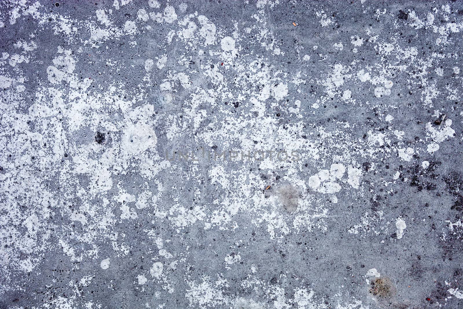 Grey concrete surface with rich and various texture. 