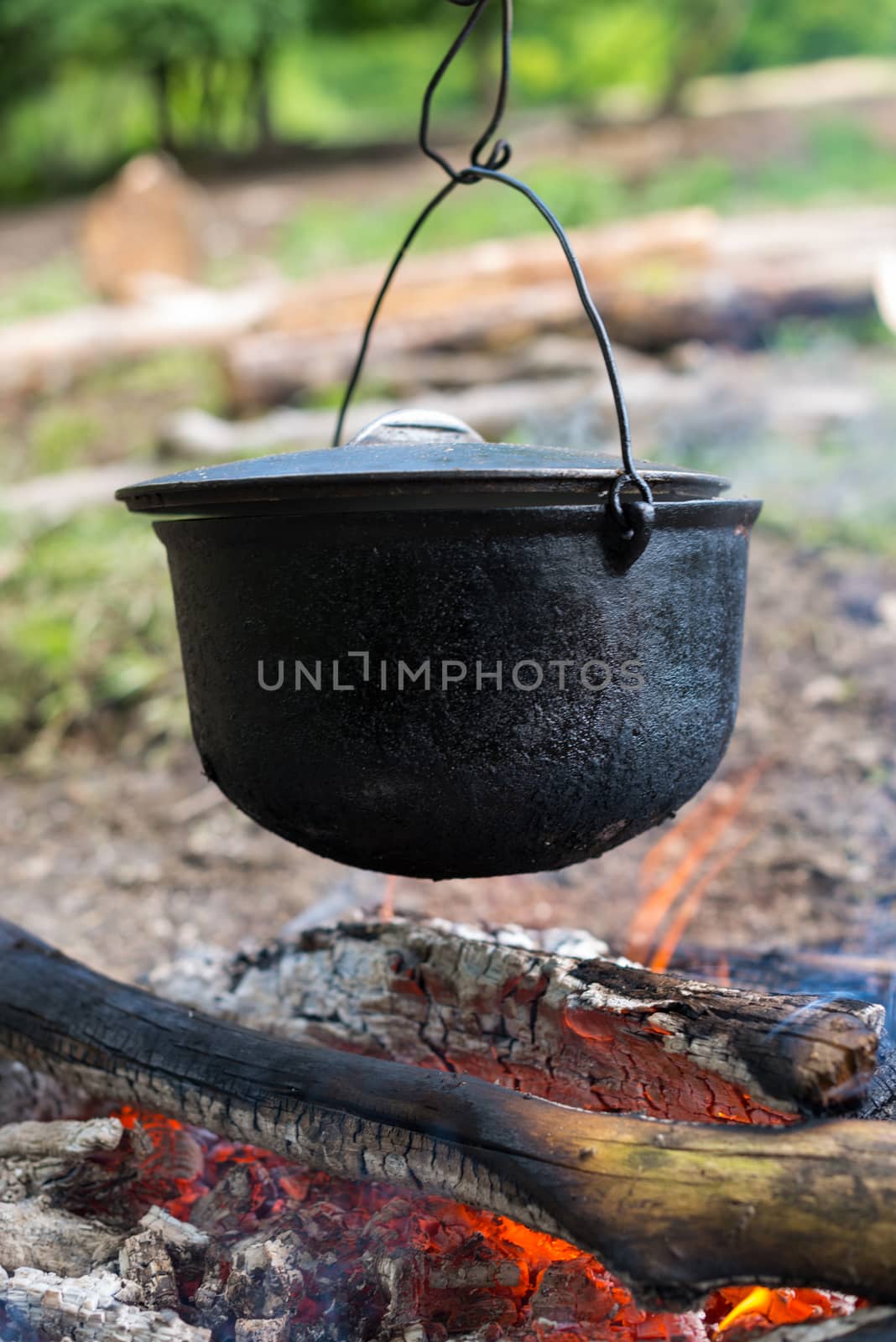 Cooking in the cauldron on the open fire.