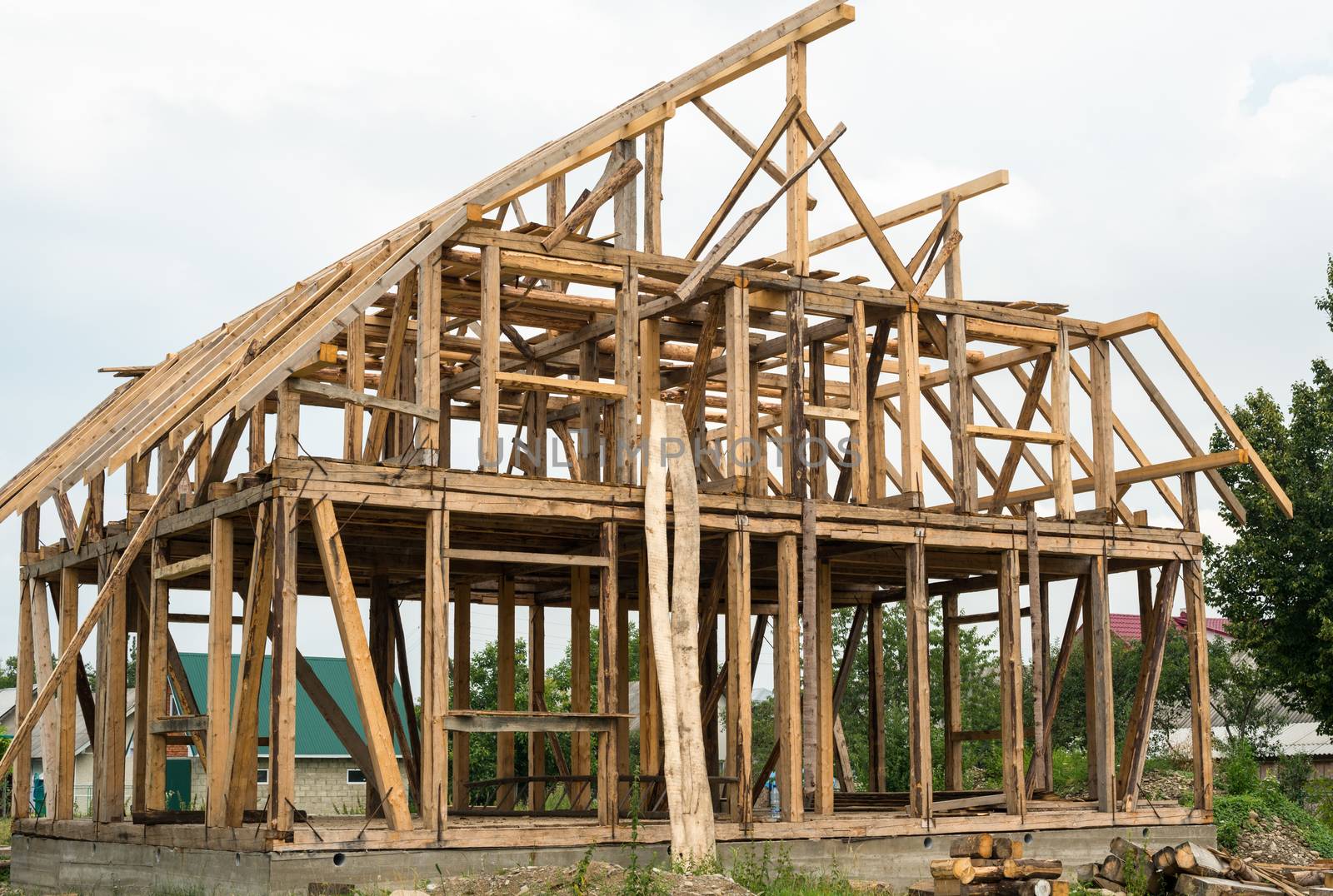 Wooden framing of the new house by rootstocks
