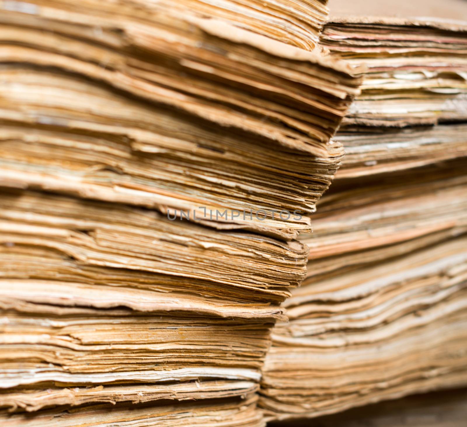 Stack of the old paper documents in the archive.