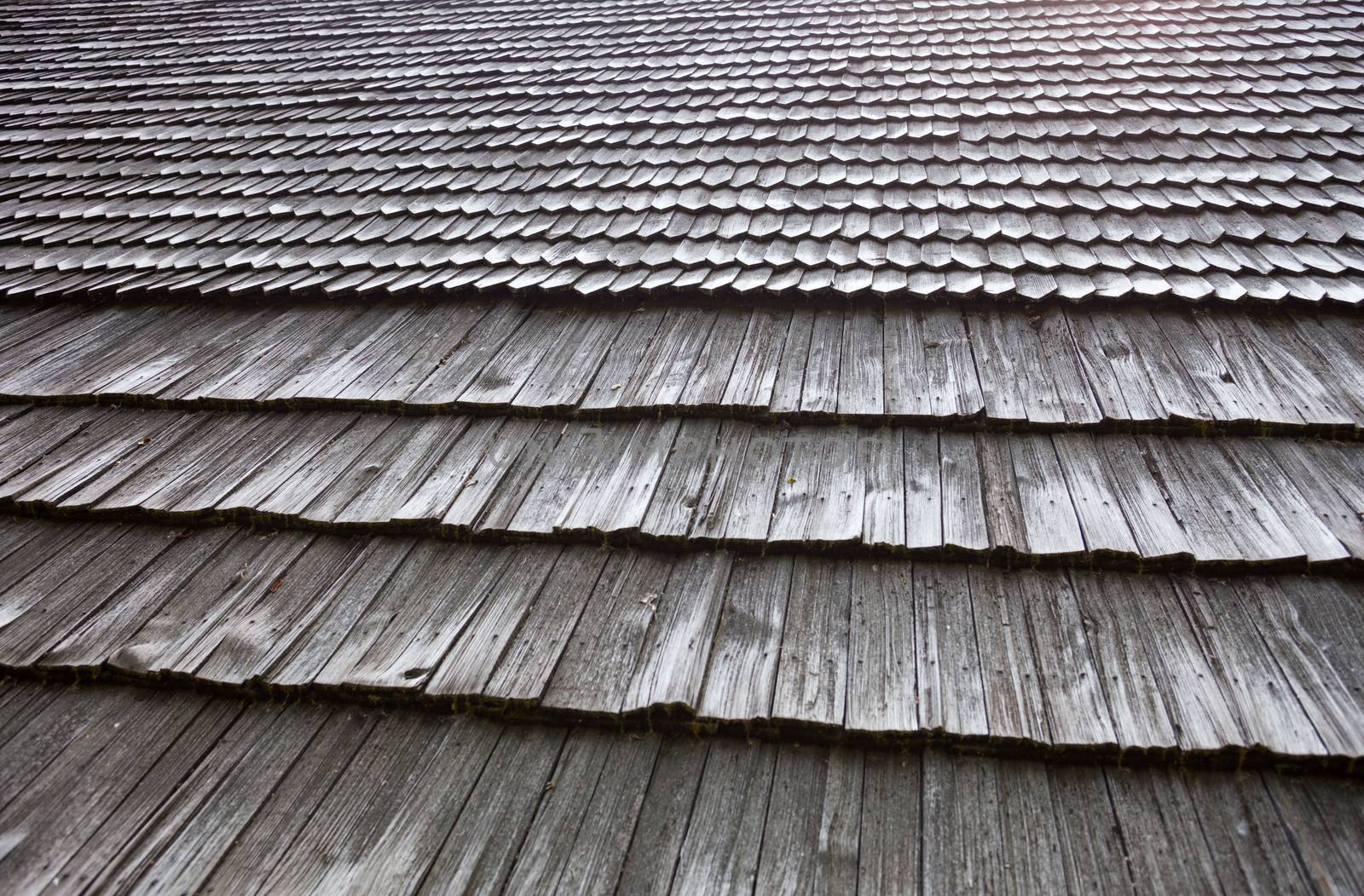 Old wooden shingle roof. Wooden surface texture.