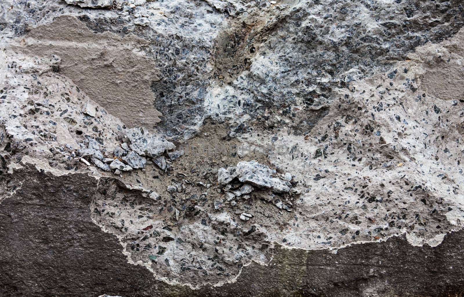Grey concrete surface with rich and various texture.