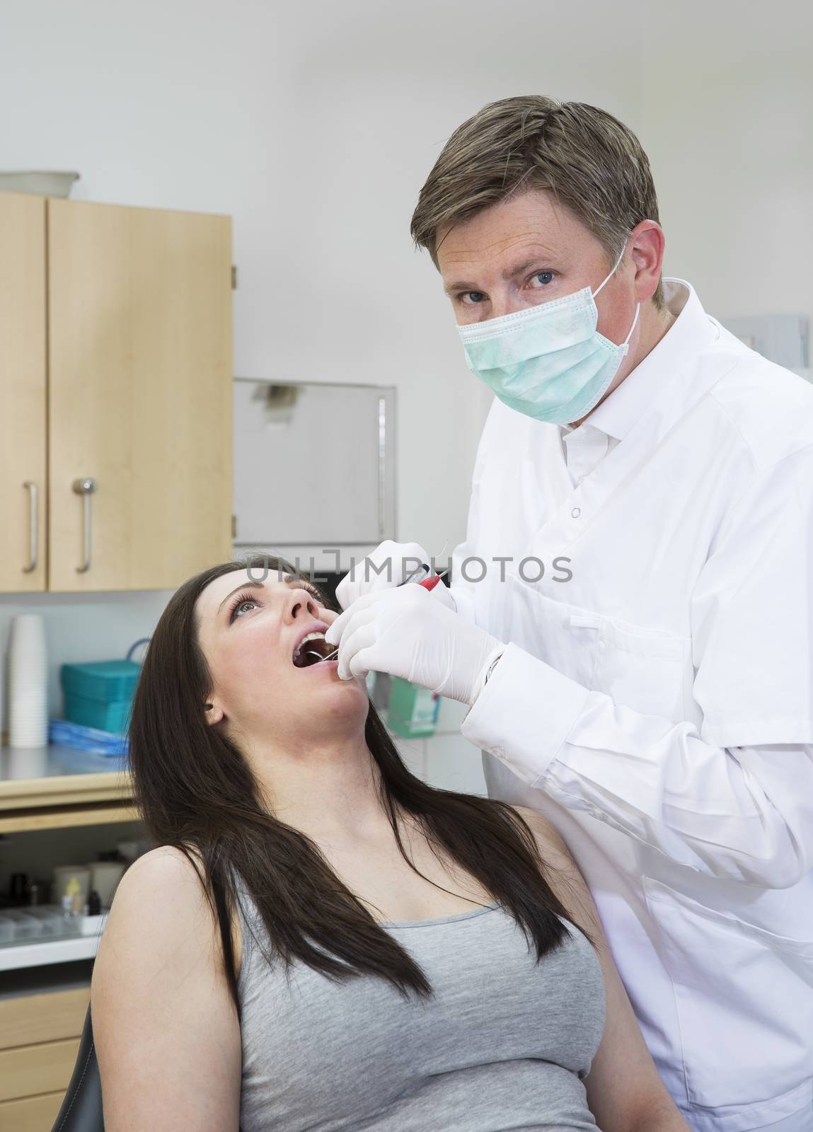 Dentist and Patient by gemenacom