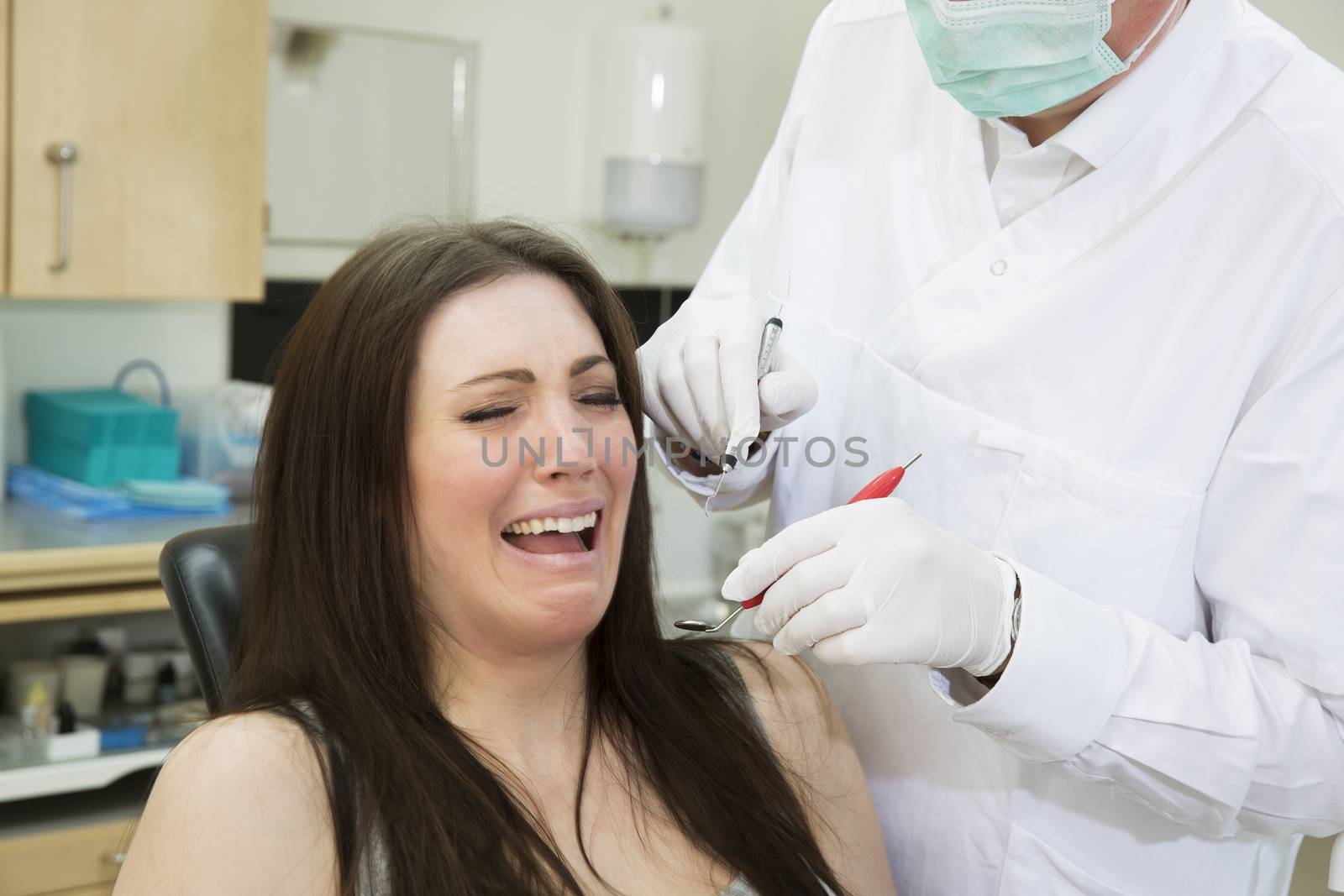 Afraid woman at the dentist