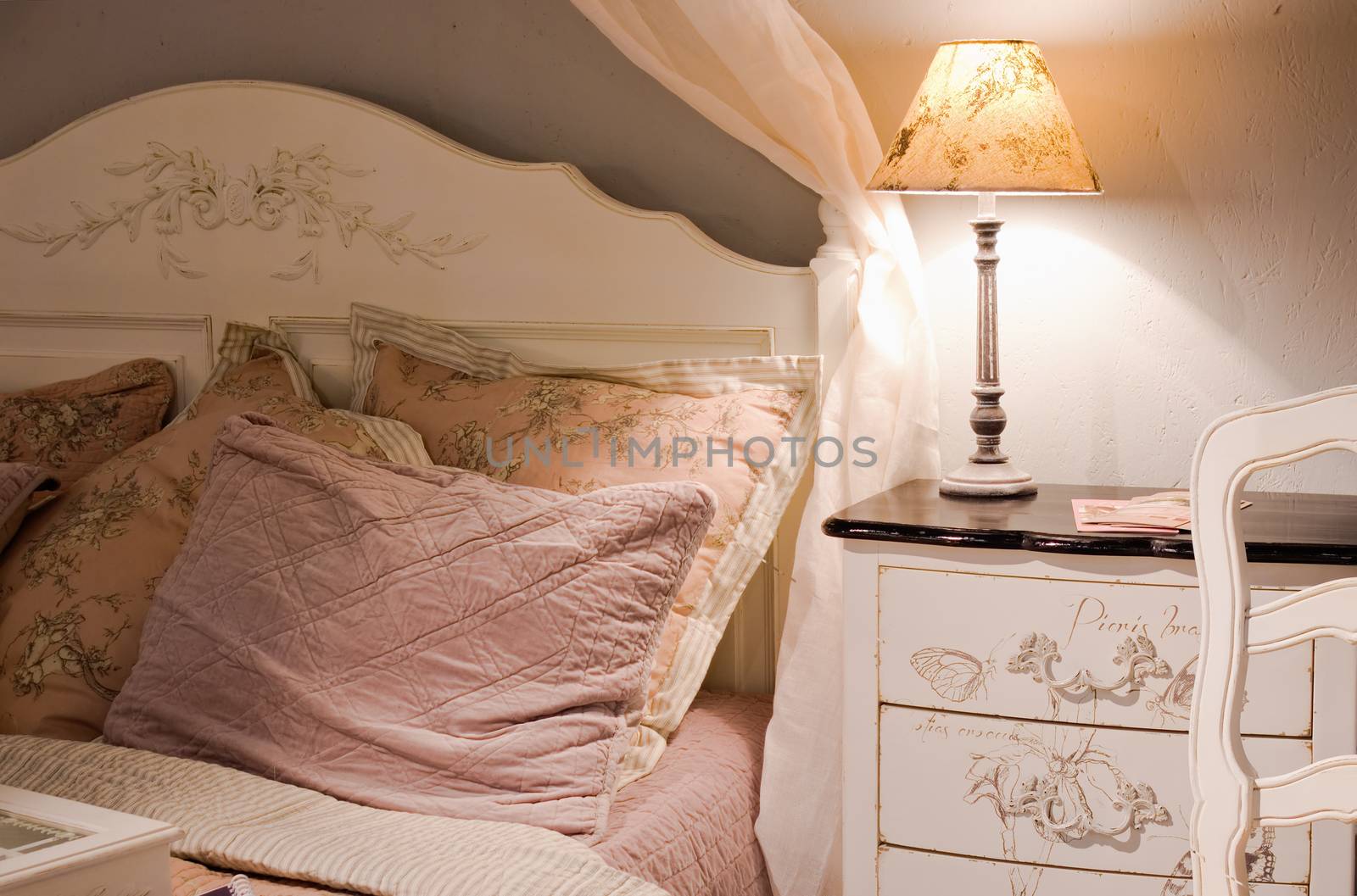 luxury bedroom with lamp on table