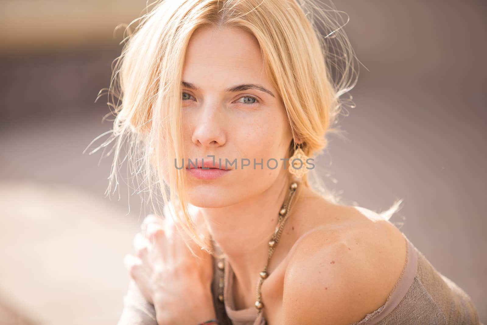 fashion portrait of a beautiful young woman on city background
