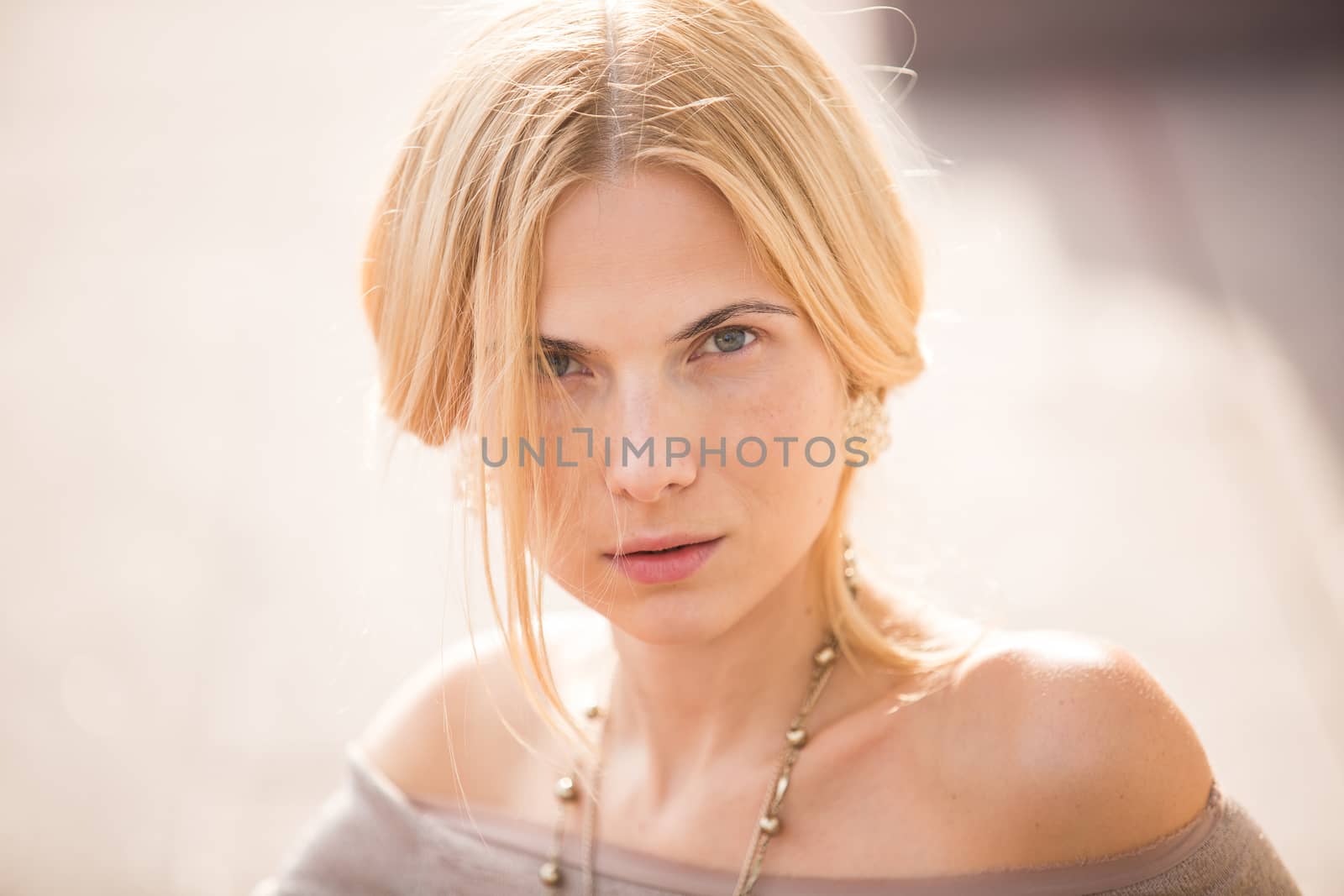 fashion portrait of a beautiful young woman on city background