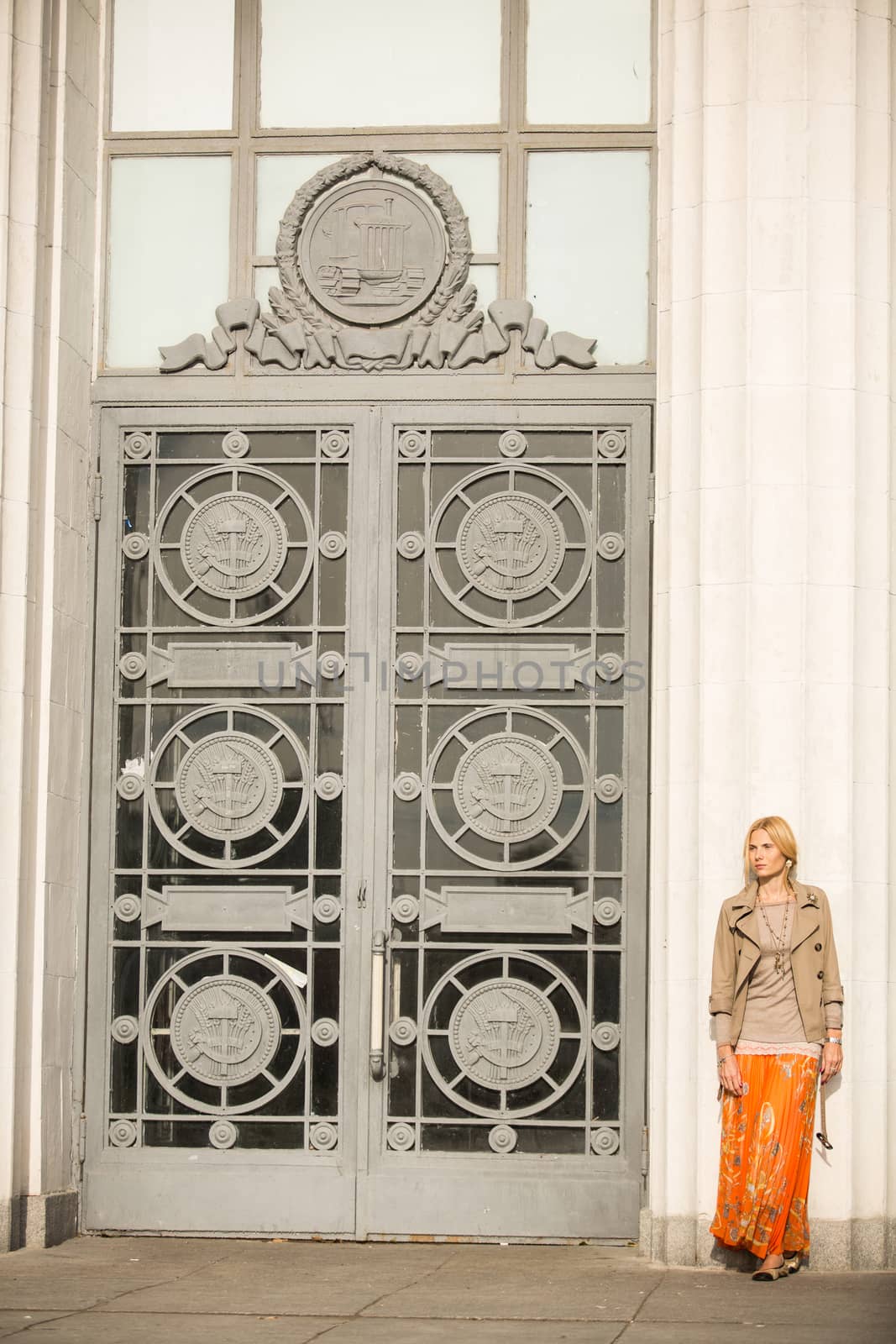 fashion portrait of a beautiful young woman on city background