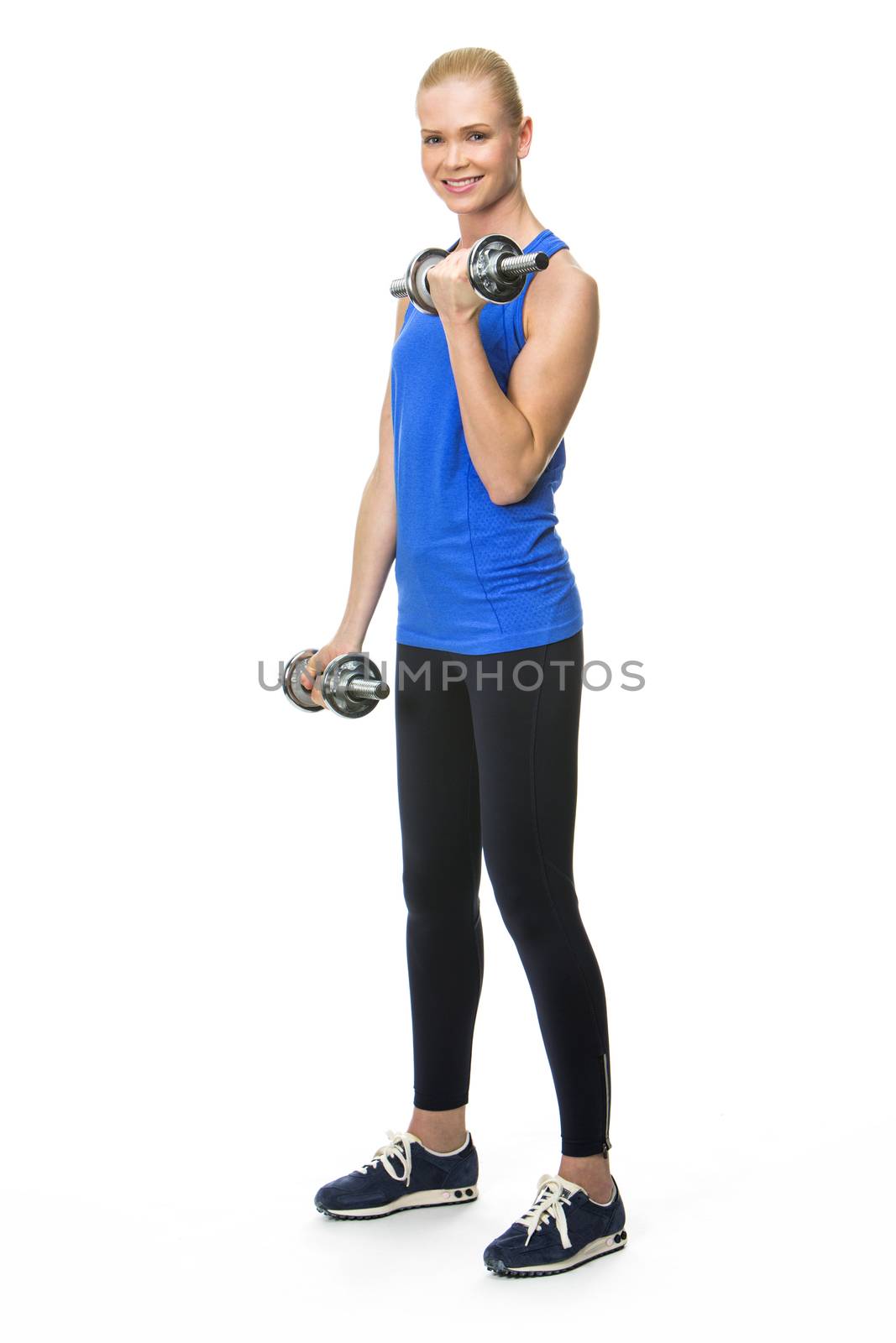 woman exercising with weights by Flareimage
