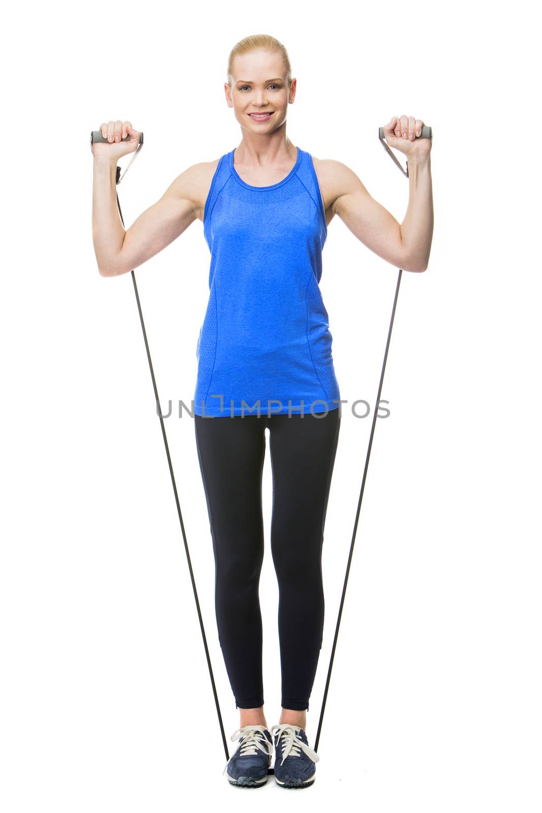 woman exercising with rubber band by Flareimage