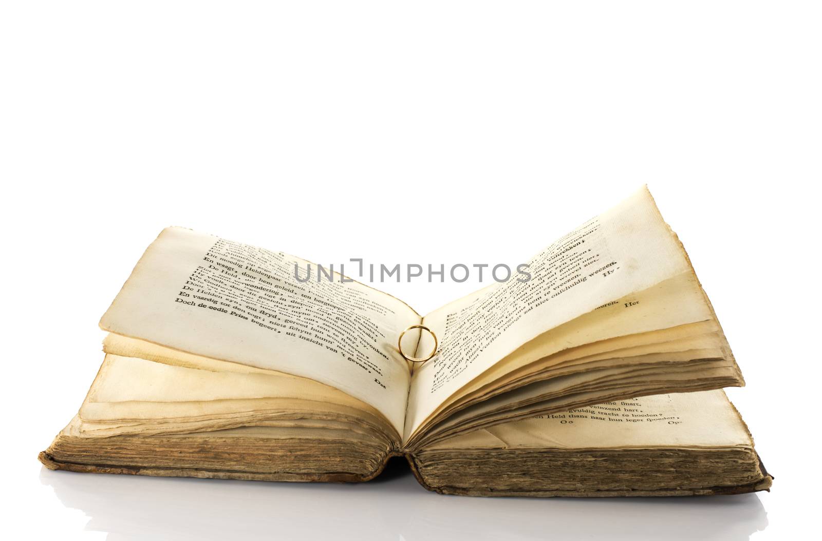 very old book with ring of romantic love for wedding or valentine david isolated on white