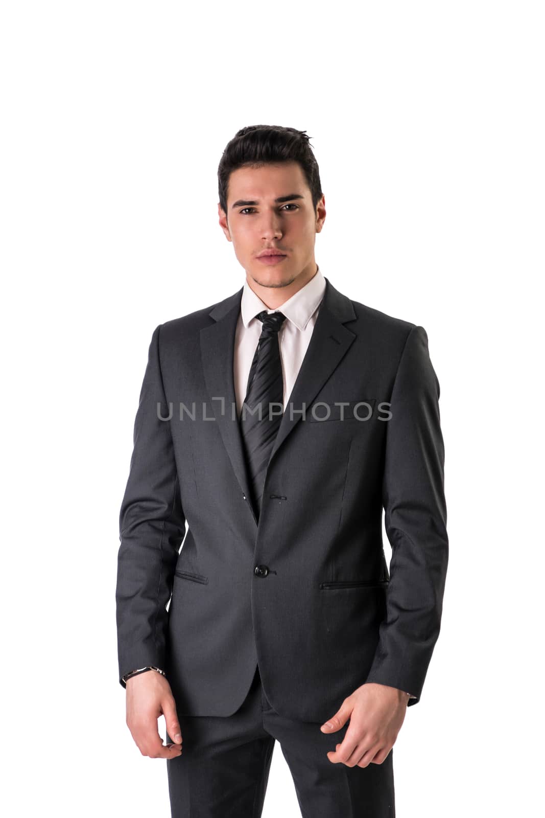 Handsome elegant young man with suit and neck-tie, isolated on white, looking at camera