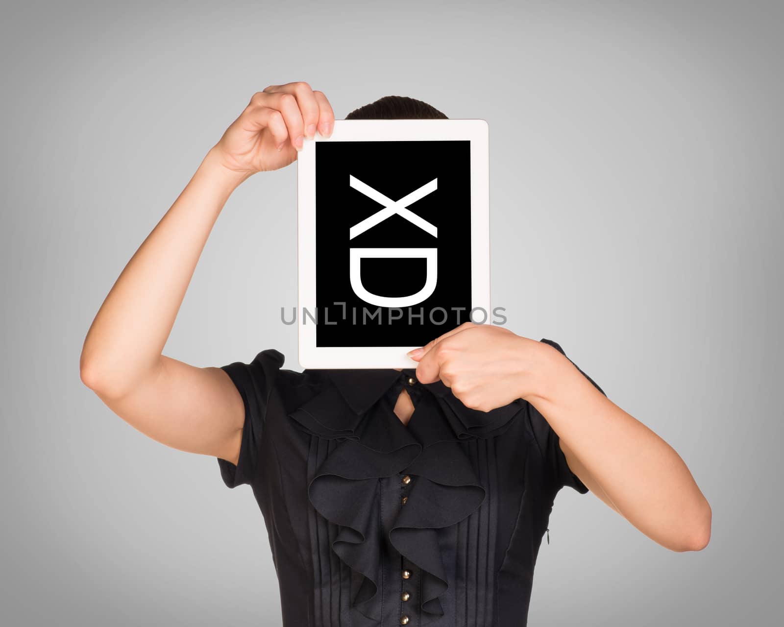 Woman in dress covered her face with tablet. On screen code smiley. Gray background