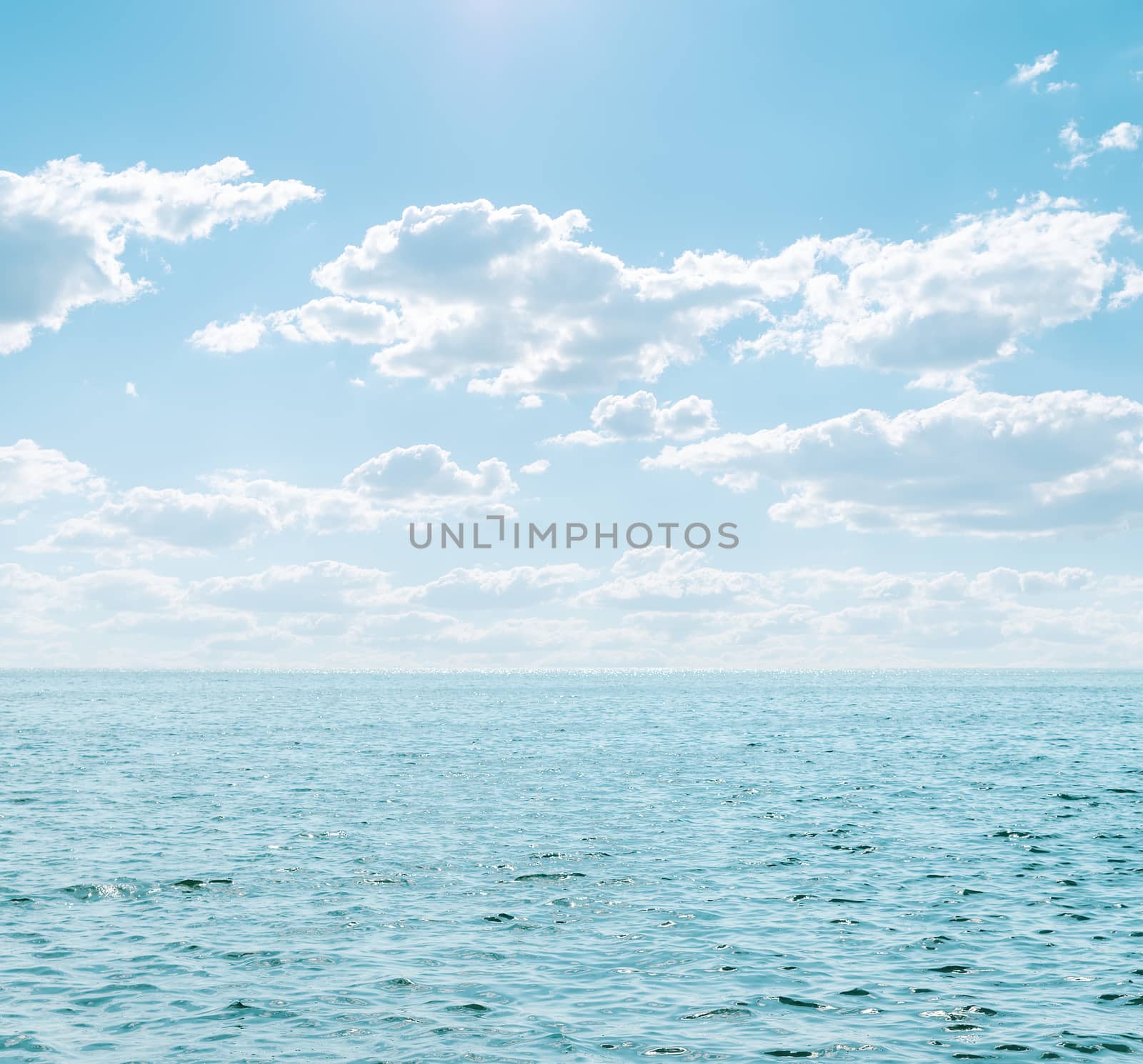light blue sea and cloudy sky by mycola