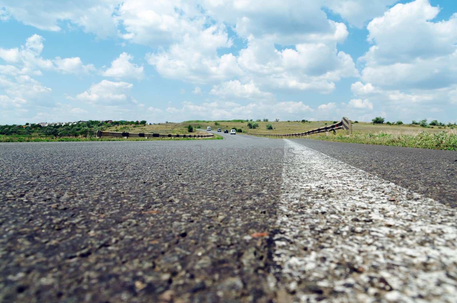 white line on asphalt road closeup. soft focus