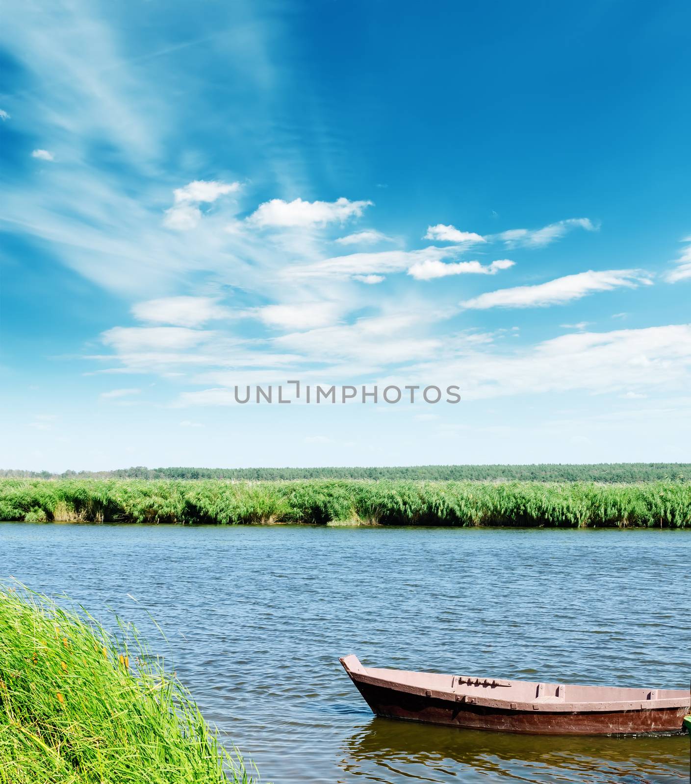 boat on river under cloudy sky