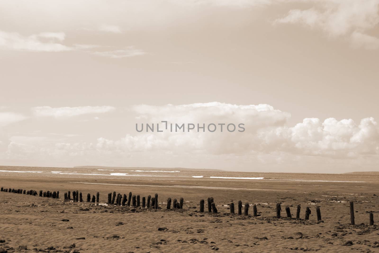 sepia wave breakers at the mouth of the cashen on ballybunion beach on the wild atlantic way