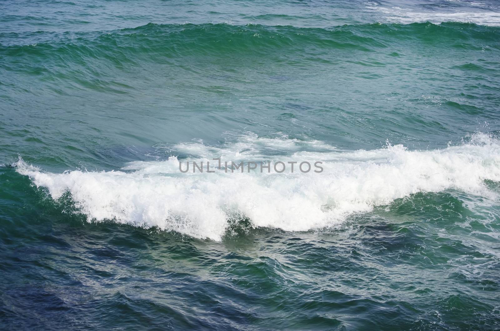 Photo of the Wavy Sea Blue Background 