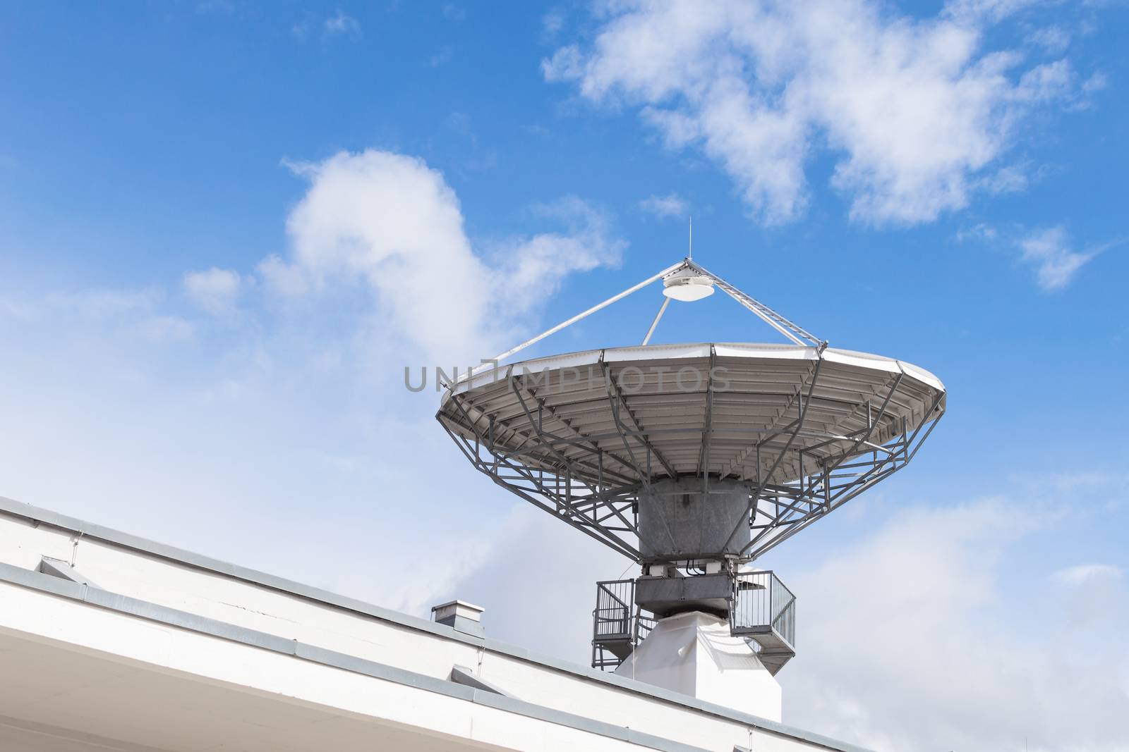 Military radiolocator station with parabolic radar antenna dish is part of missile defense antimissile system