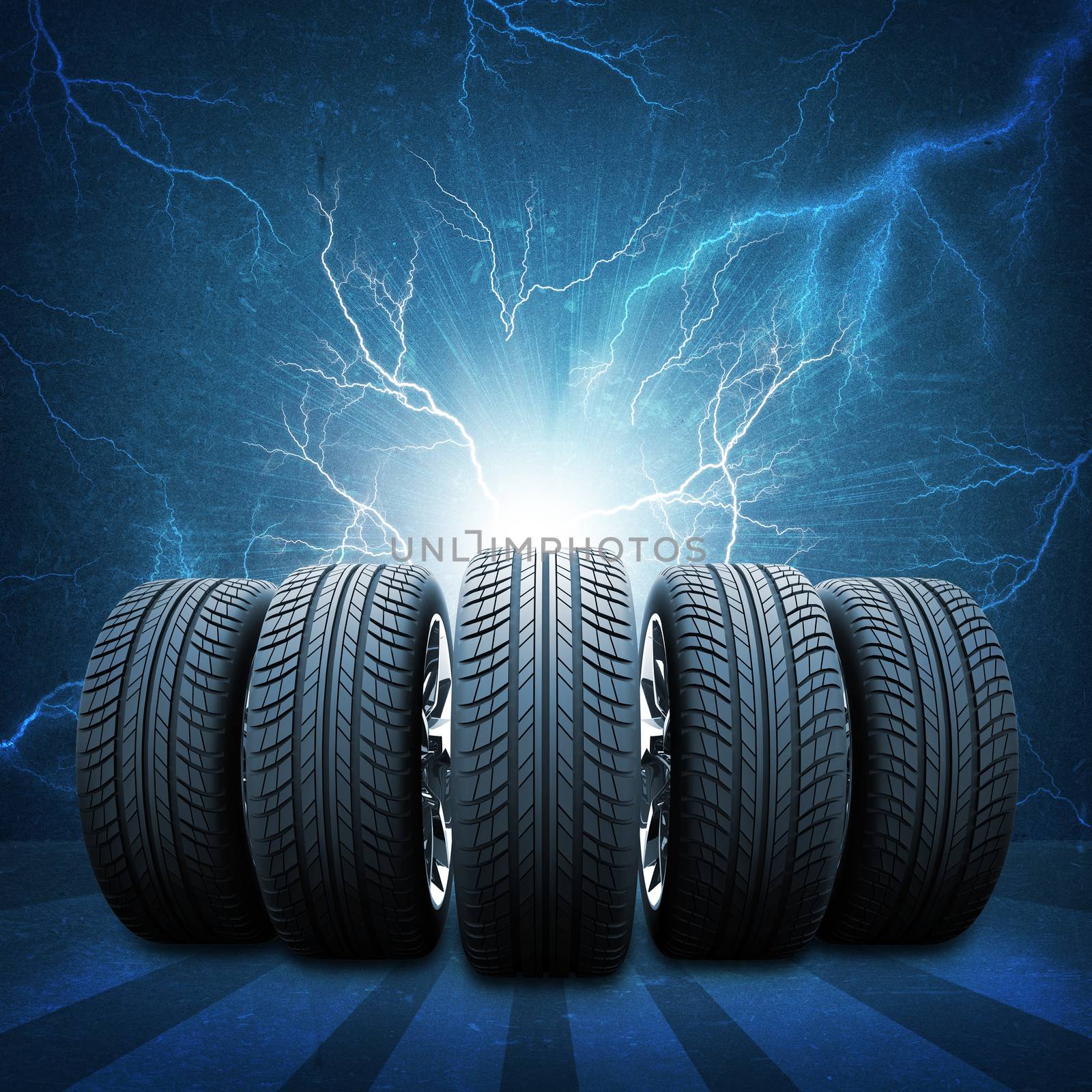 Five of new car wheels. Abstract background is concrete wall, lightning and stripes at bottom
