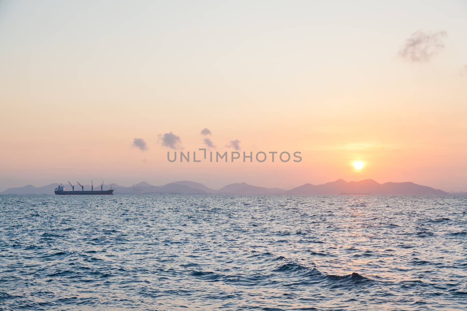 Large cargo ships and the sunrise in the morning. by a454