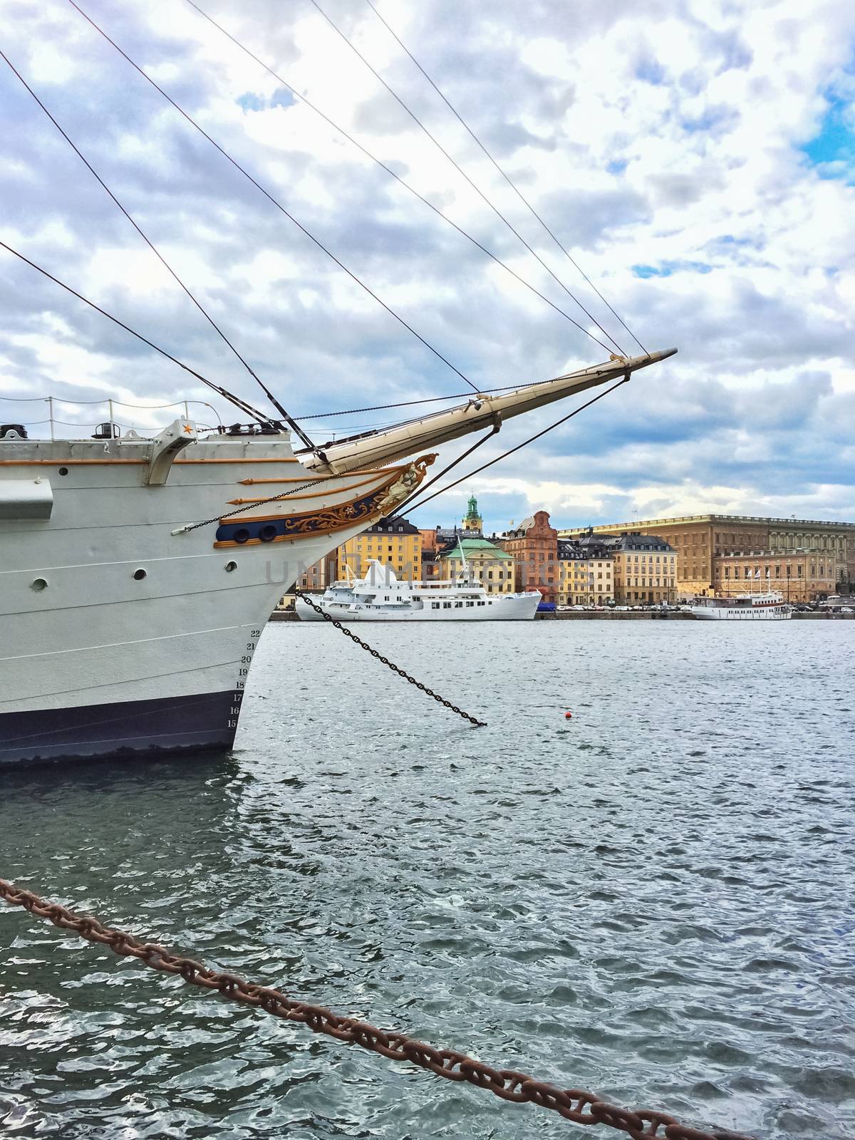 White ship and view over historic Gamla Stan in Stockholm, Sweden.