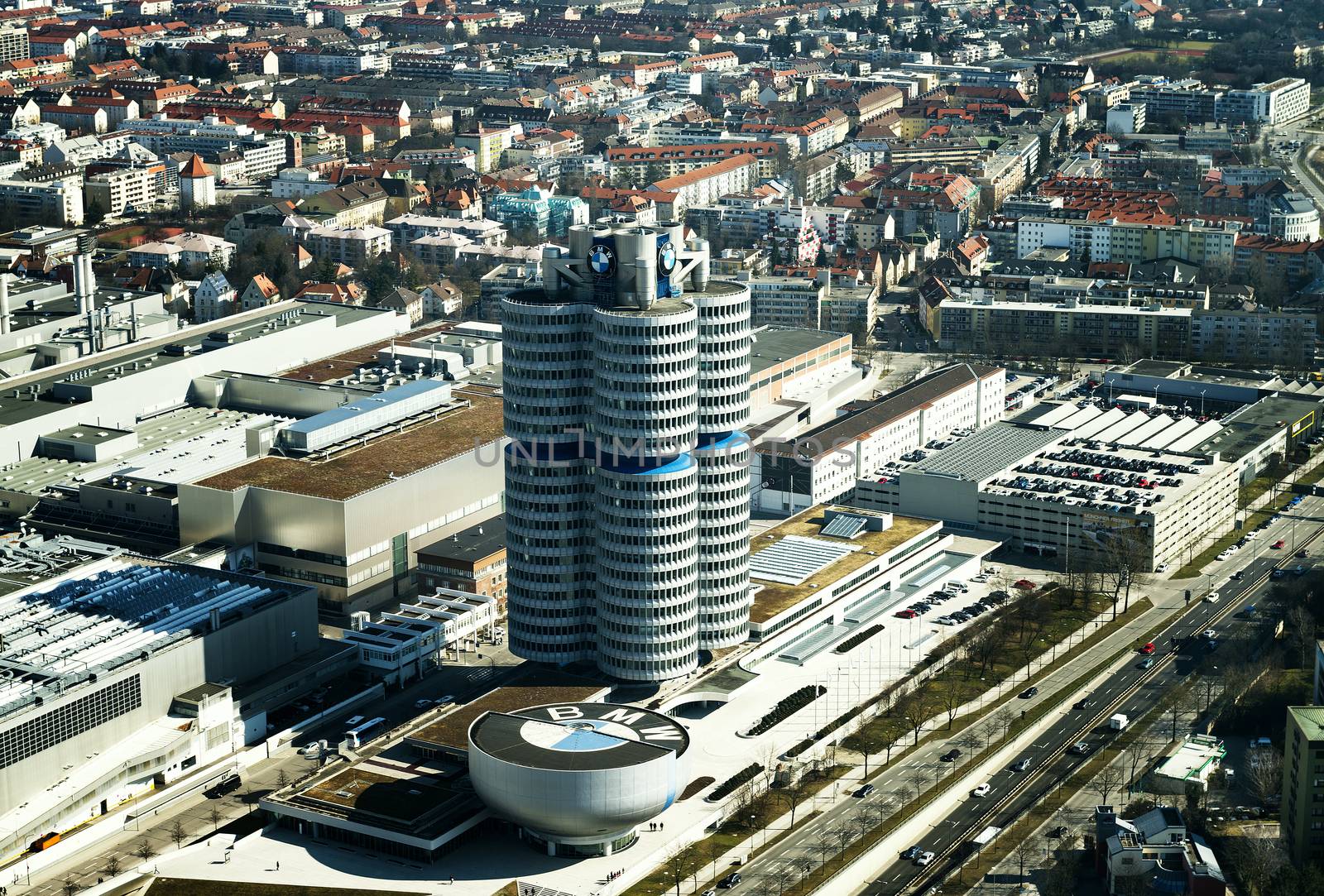 MUNICH, GERMANY - MARCH 10 : BMW Headquarters on March 10, 2015. The four vertical cylinders building is a Munich landmark which is world headquarters for the Bavarian automaker.