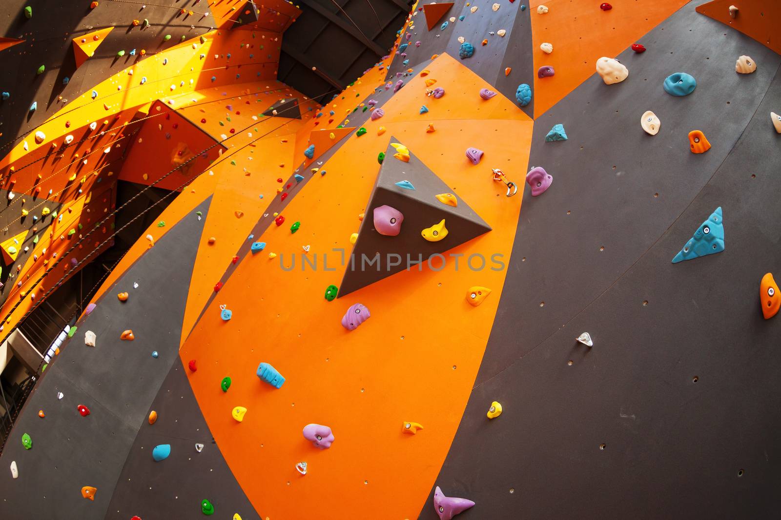 Artificial climbing wall in climbing gym by photobac