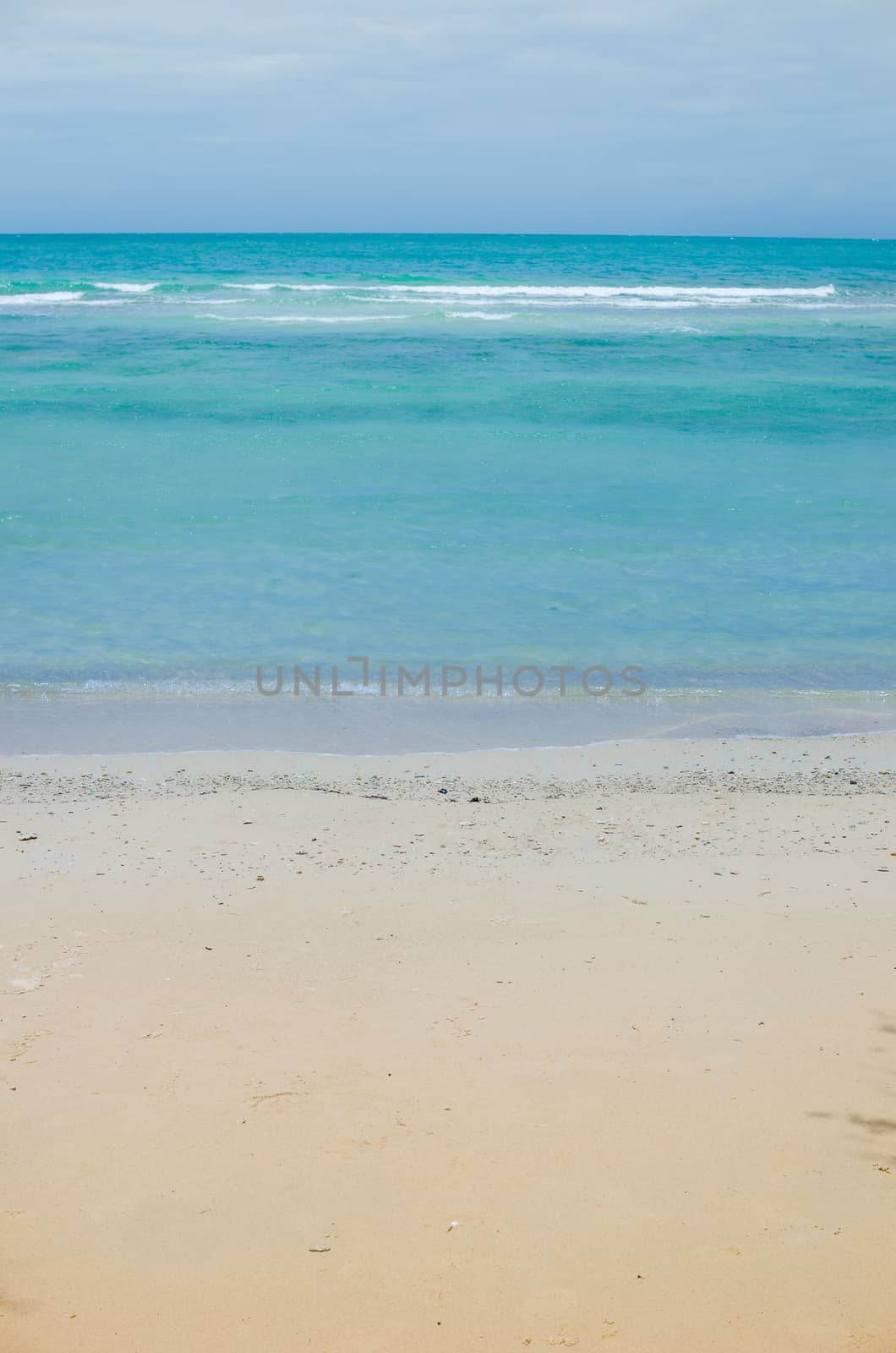 Beach sand and blue sea in Thailand