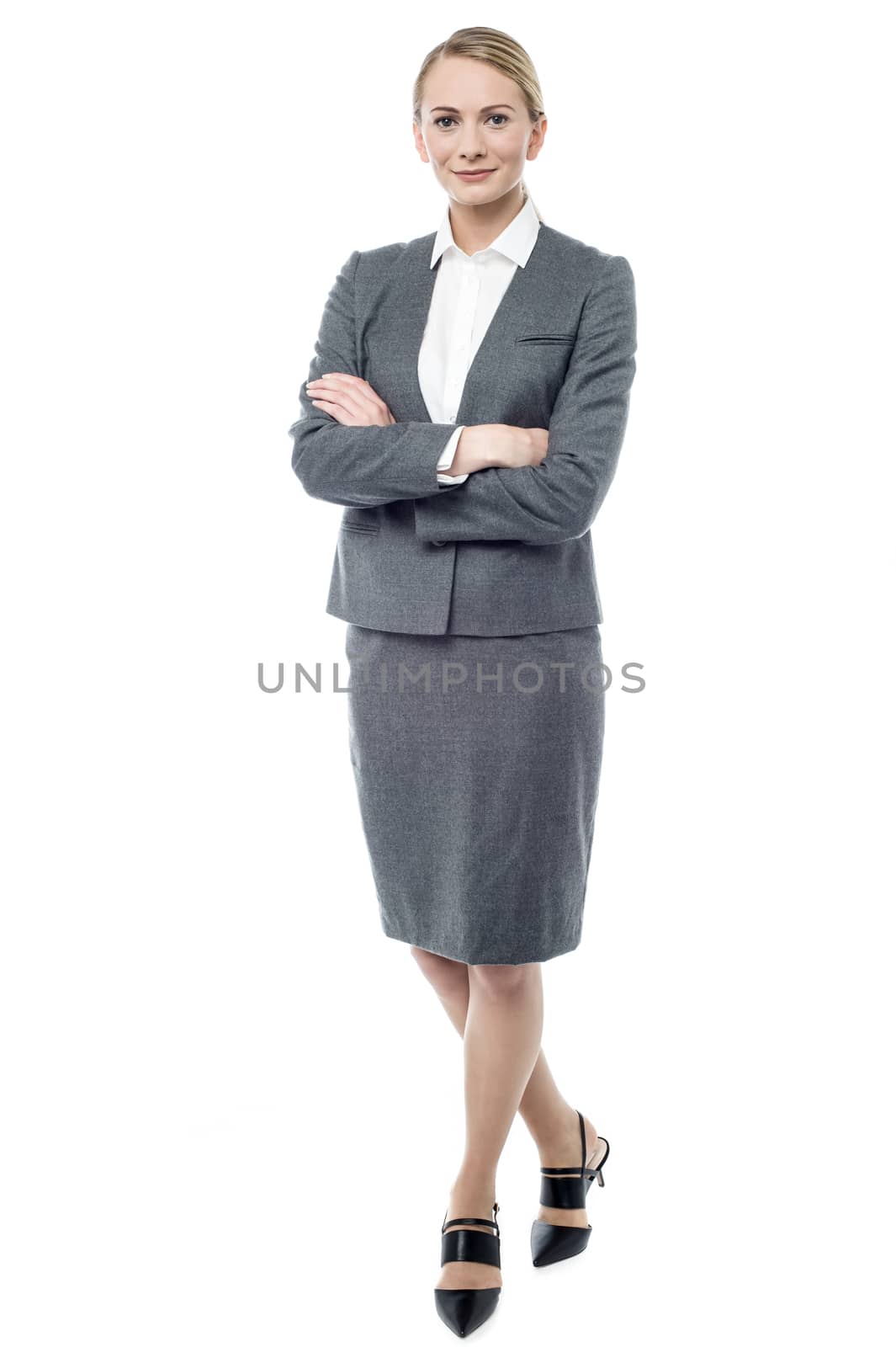 Full length of businesswoman with folded arms