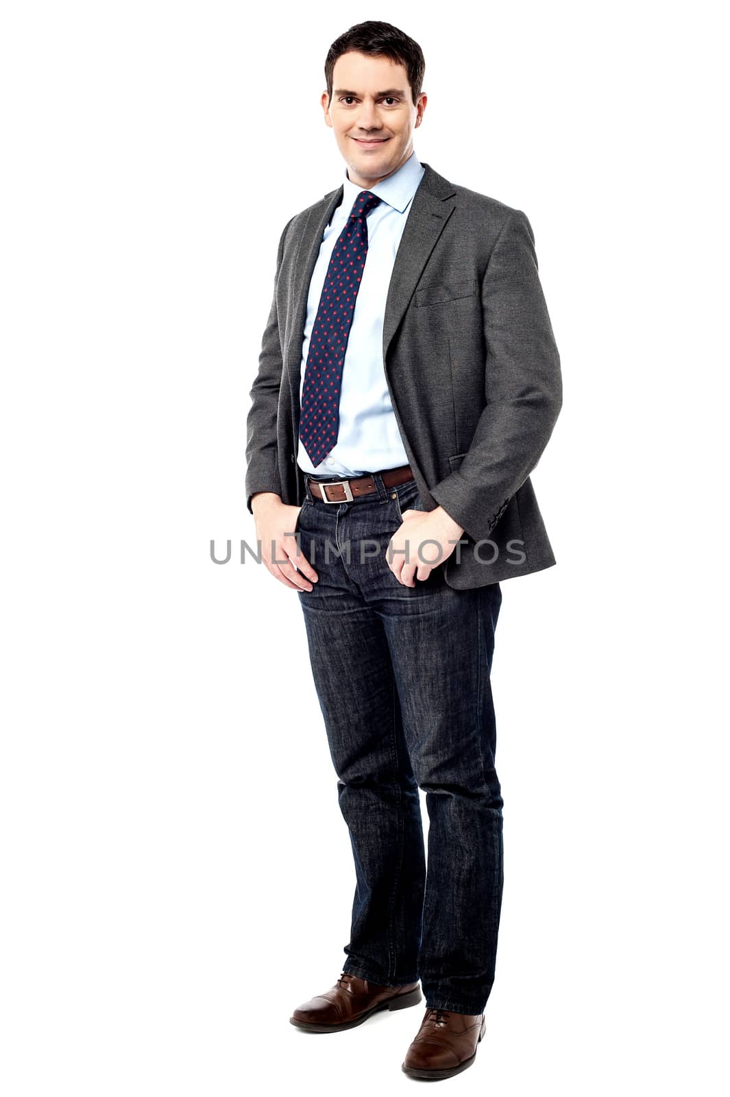 Full length of male entrepreneur with hands in pockets