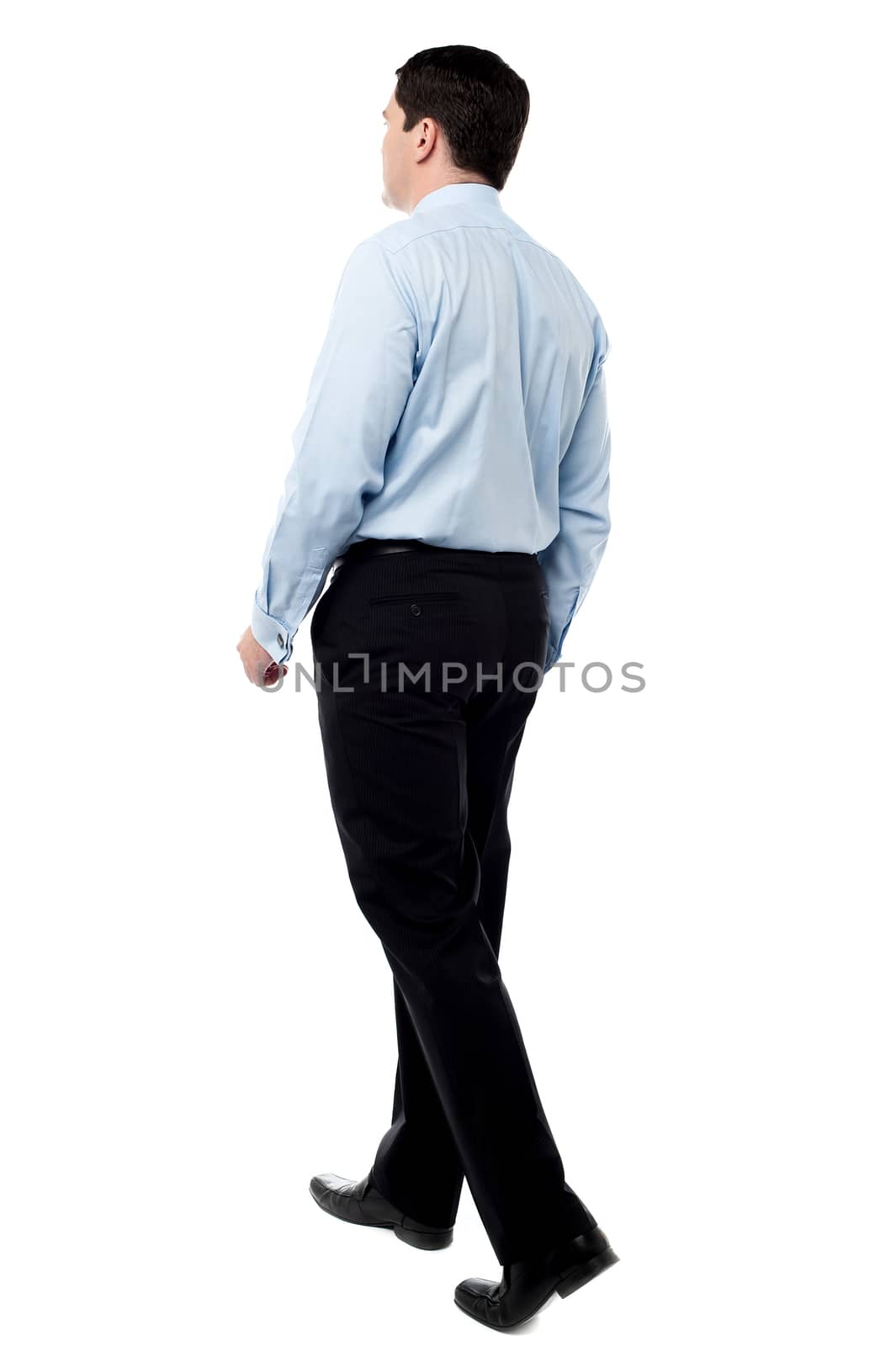 Full length of businessman going forward