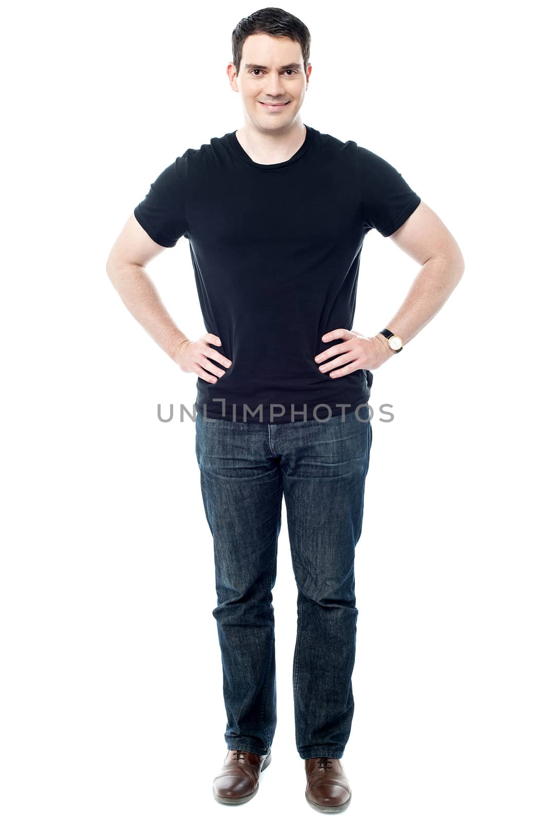 Casual young man posing, hands in waist